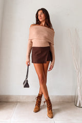 The VESPER MINI SKIRT in brown is the perfect mix of style and comfort. The overlap front detail adds a touch of flair, while the back zipper closure makes it easy to slip on and off. With shorts underneath and stretchy fabric, this mini skirt is both practical and flattering.