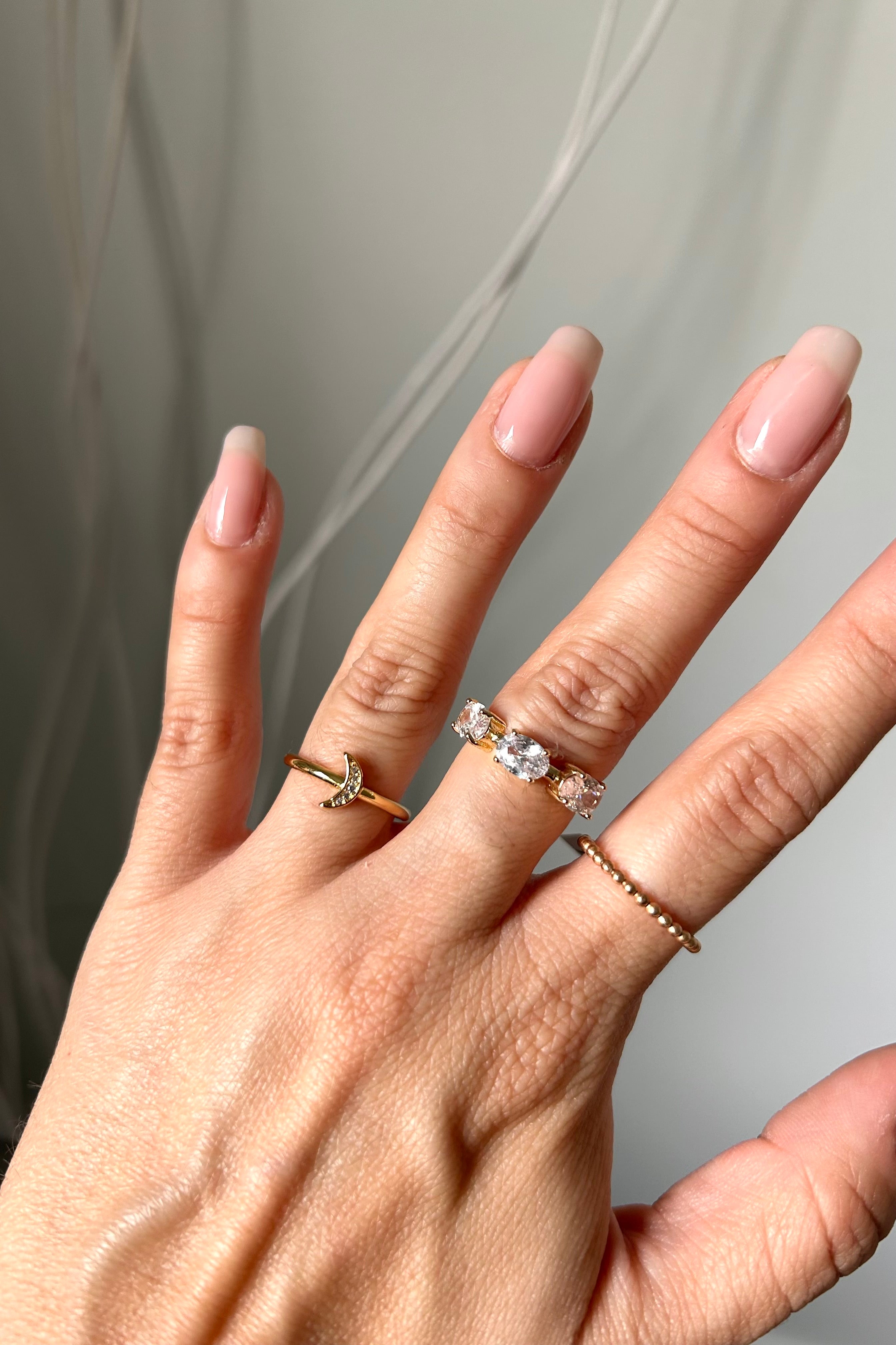 Introducing our NEW RING COLLECTION - featuring three styles to elevate your look! These gold plated over sterling silver rings are both tarnish resistant and hypoallergenic. Add a touch of elegance with the Emerald Square Ring, a dash of boho with the GF Beaded Ring, or embrace your inner moon child with the Pave Mini Crescent Ring. Choose your style and shine on!