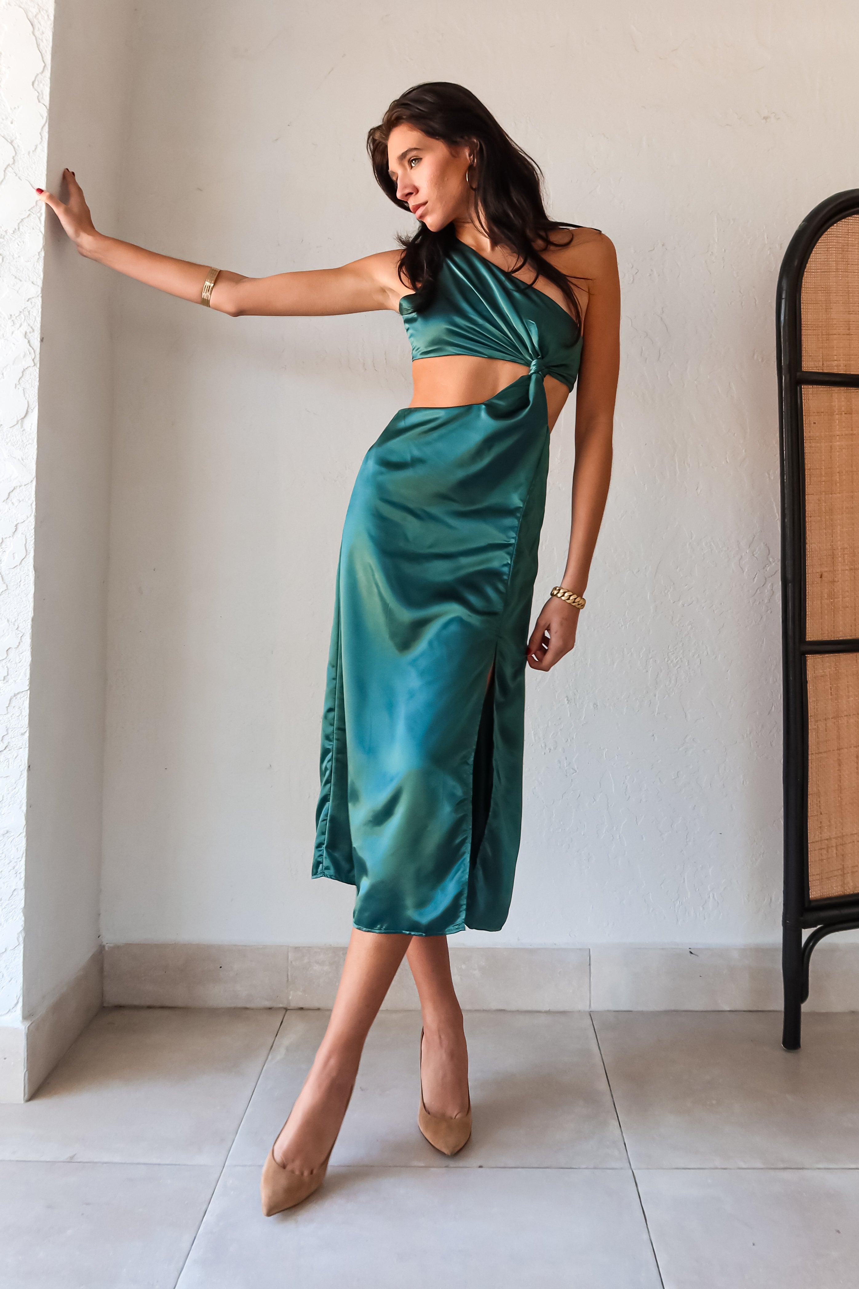 Get ready to slay at cocktail hour with this jewel green satin maxi dress! The one shoulder top with a knot detail adds a touch of glamour, while the left leg slit shows off your killer legs. Ties around back keep the look secure, and a bottom zipper closure makes getting dressed a breeze.