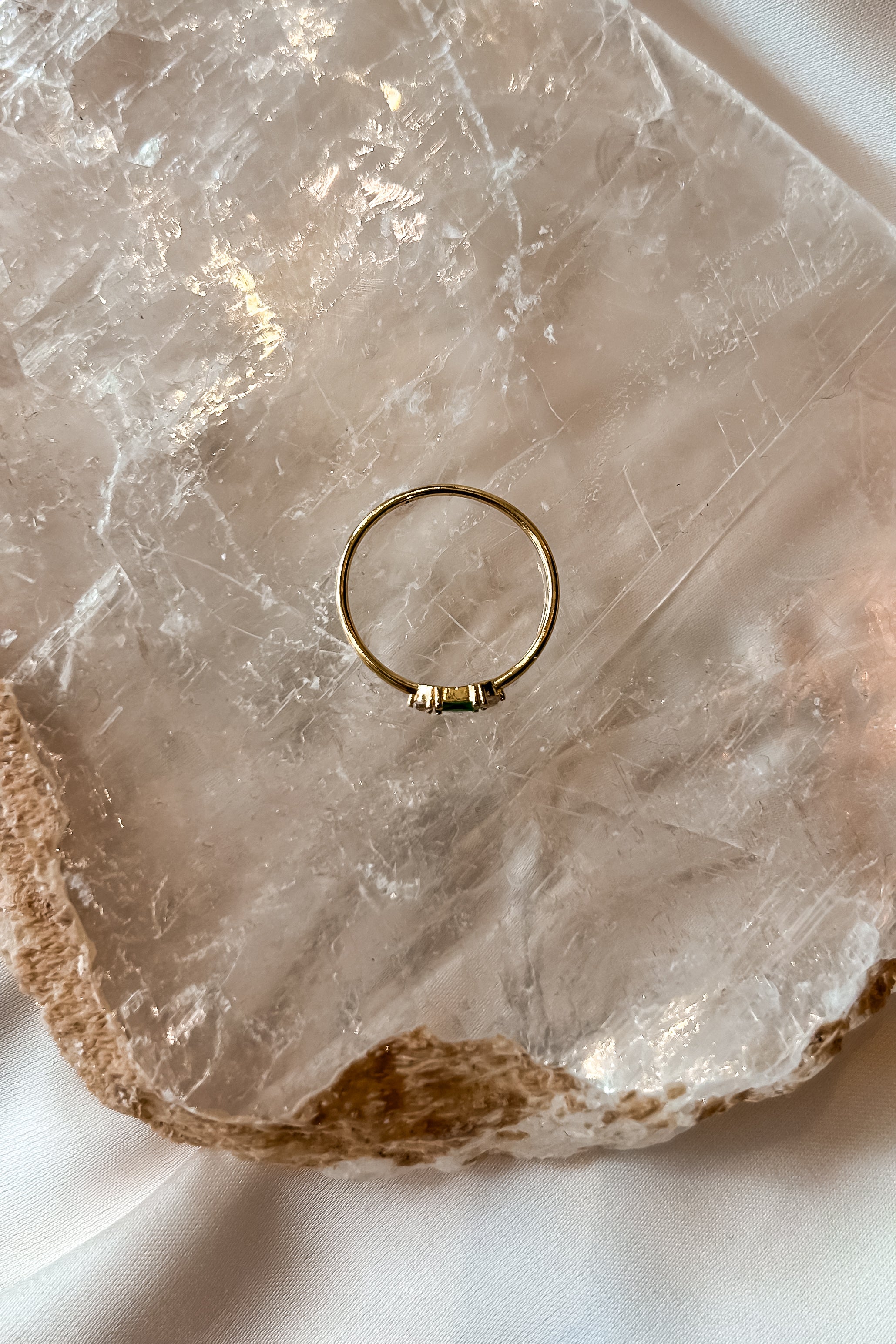 Add a touch of sparkle to your ensemble with our Vermeil Emerald Ring. This playful piece features a gold-plated 925 sterling silver band and a stunning emerald gemstone. Its tarnish resistant design ensures long-lasting wear. Sized for a perfect fit.