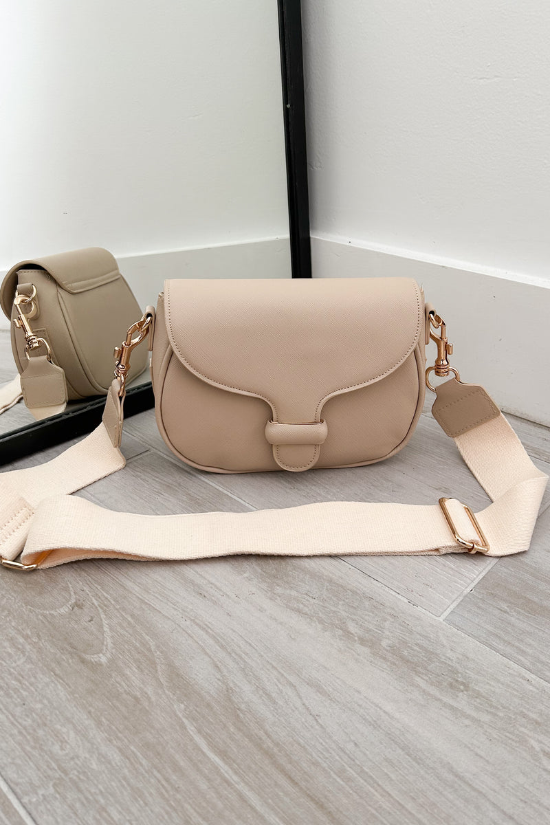 Sling in style with our GRETA TEXTURE CROSSBODY BAG. Made from vegan leather, it features a removable crossbody strap and gold buckle detail. Stay on trend with magnetic and zipper closures. Your perfect carry-all, minus the guilt!