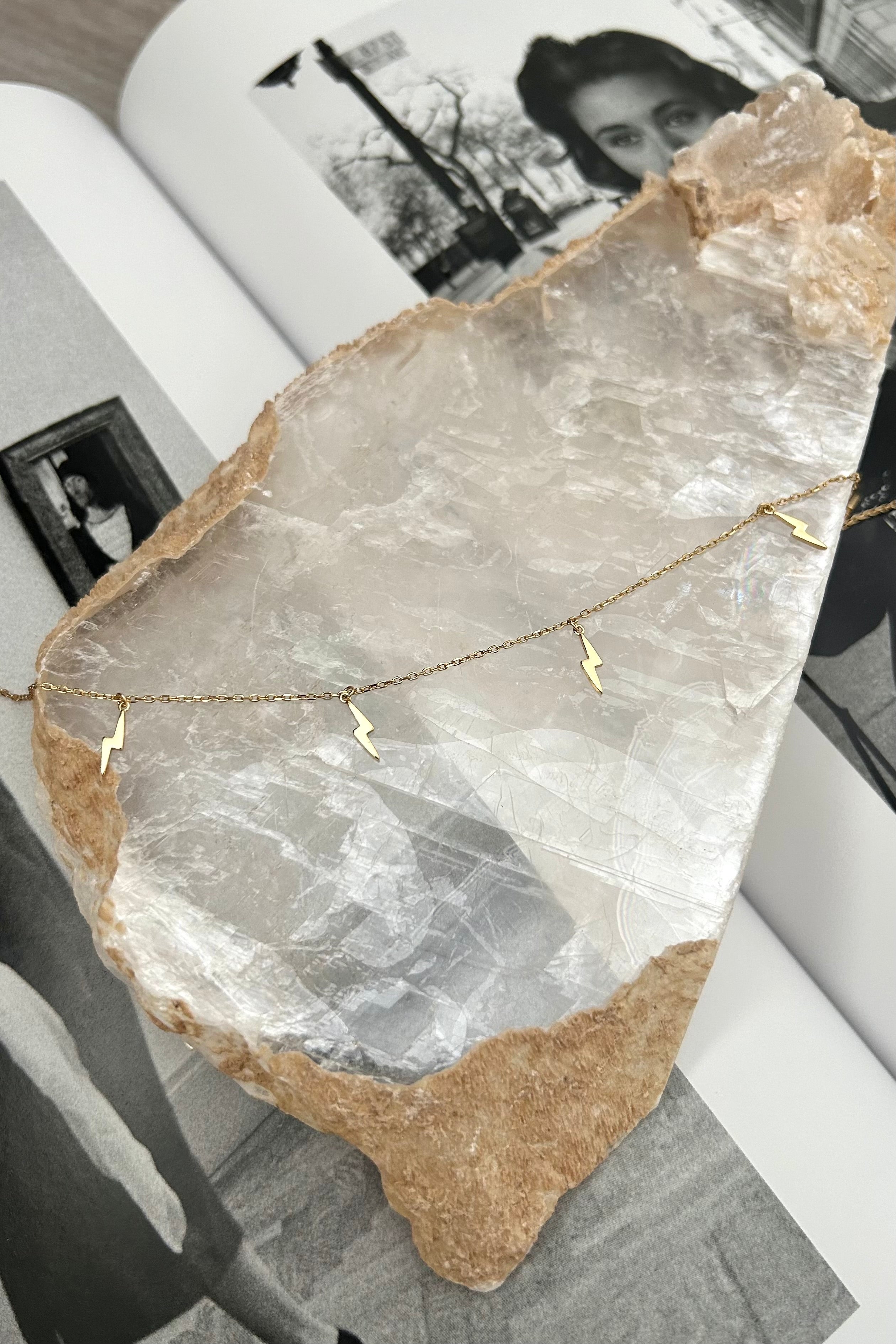 Get struck by style with the BOLT CHOKER! This gold plated choker features a charming lightning bolt detail and is made with tarnish-resistant, hypoallergenic sterling silver. No need to fear an allergic reaction or dull, tarnished jewelry. This choker is sure to add a shock of chic to any outfit.