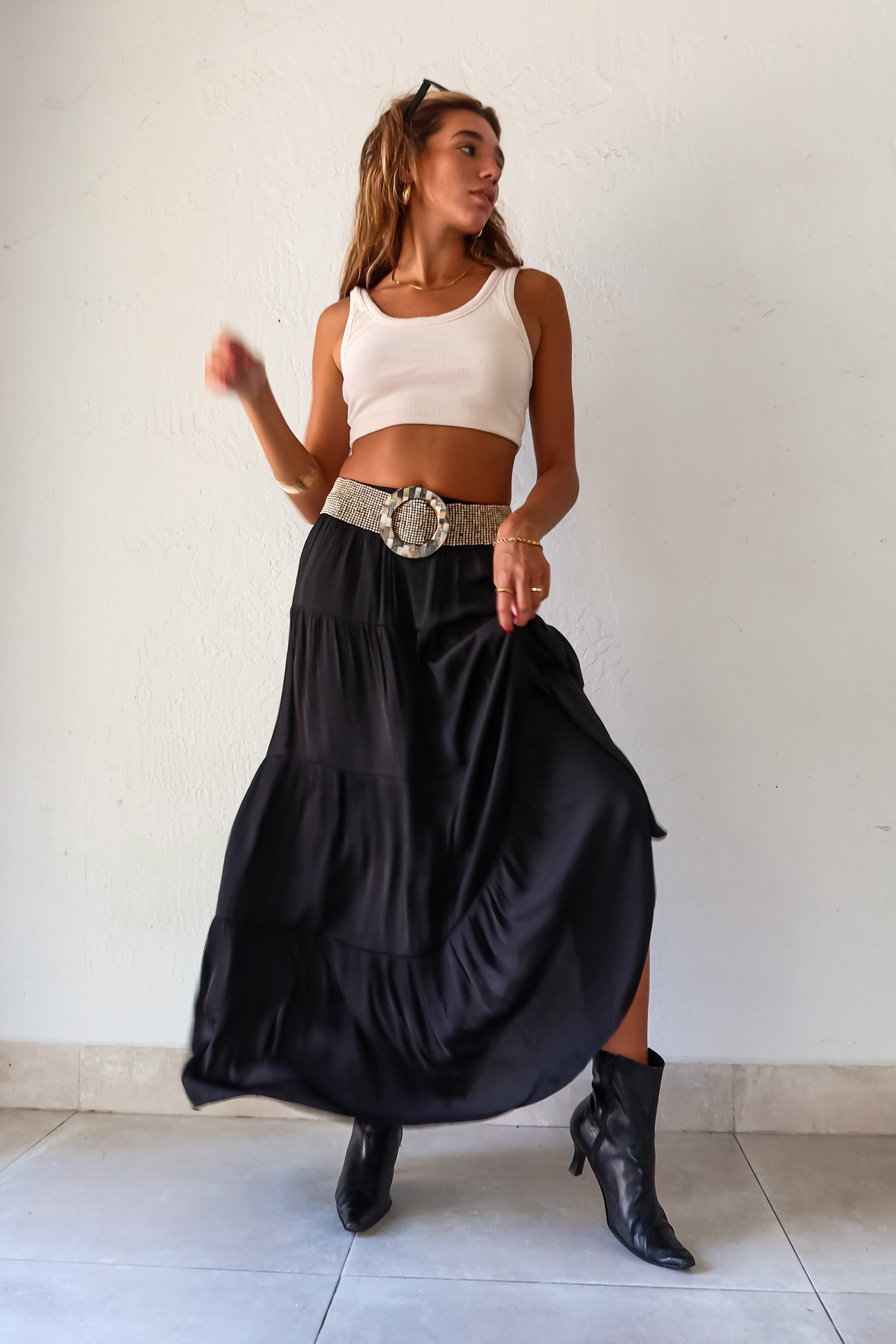  elegance and edge to your wardrobe with the Venus Satin Maxi Skirt in black! The non-stretch satin fabric flows beautifully while the elastic waistband provides a comfortable and flattering fit. Fully lined for a luxe feel 