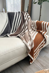 Stay cozy and stylish with our Striped Microfiber Blanket! Made of 100% polyester microfiber, this white blanket with navy, khaki, and brown stripes is perfect for snuggling up on chilly nights. Measures 50x60 inches. Upgrade your comfort game now!