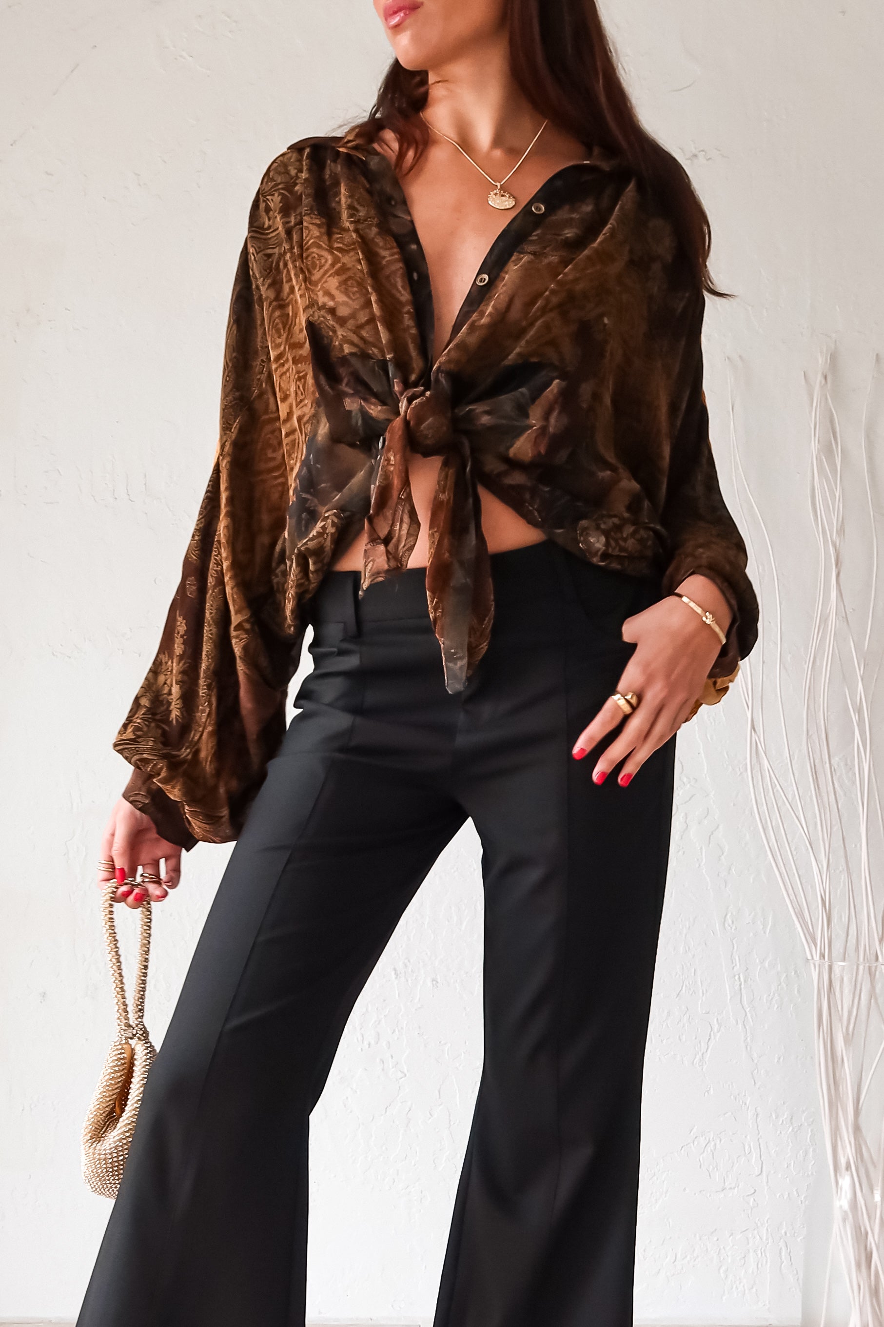 Rock your style in the playful Zeppelin Blouse in camel. This sheer chiffon shirt features a khaki/brown/tan collard design, front button down, and a convenient front left chest pocket. Versatile as a cover up, this blouse is perfect for effortless, fun fashion.