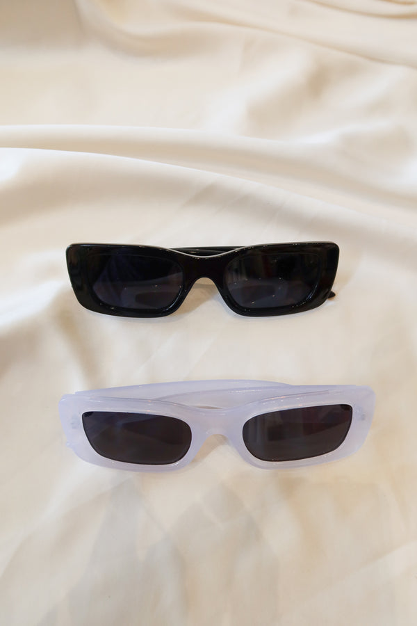 LOLO SUNNIES! These black or white thick frame sunglasses provide 6in length and frames measuring 2in x 1.25in, with acrylic UV protection. Stay cool while making a statement!