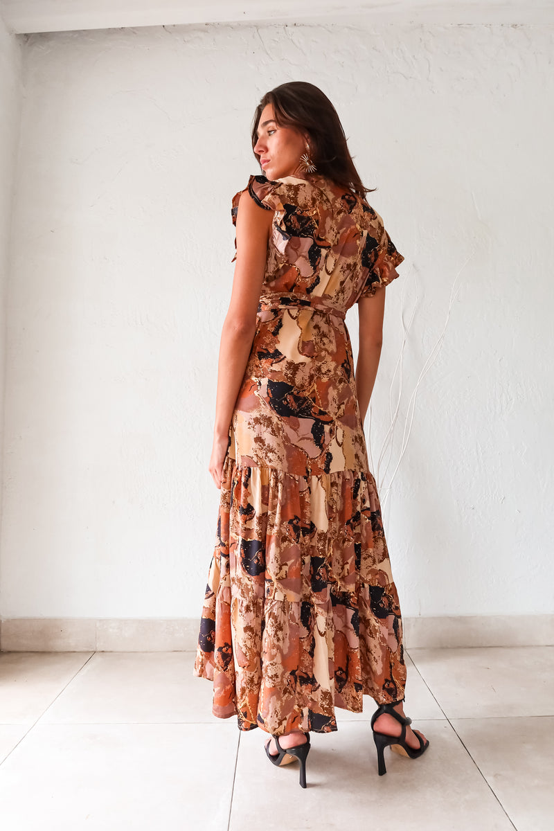 Unleash your inner fashionista with our MADRID WRAP MAXI DRESS! Features a unique and playful Brown/Khaki/Black Madrid style design, with a wrap closure and side tie for the perfect fit. Adorned with a ruffled shoulder and overlap v neckline, this dress is sure to turn heads and make a statement. 