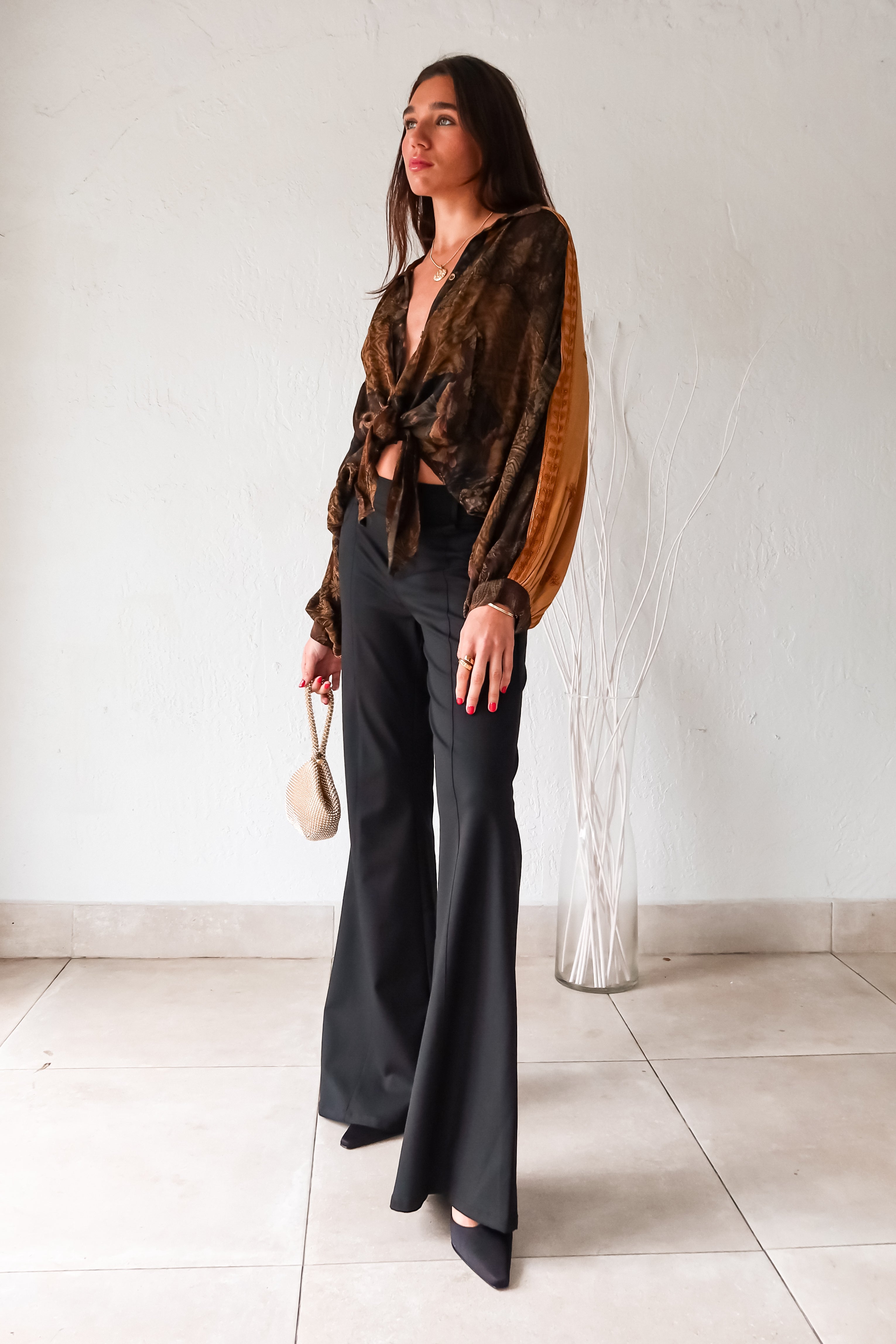 Rock your style in the playful Zeppelin Blouse in camel. This sheer chiffon shirt features a khaki/brown/tan collard design, front button down, and a convenient front left chest pocket. Versatile as a cover up, this blouse is perfect for effortless, fun fashion.