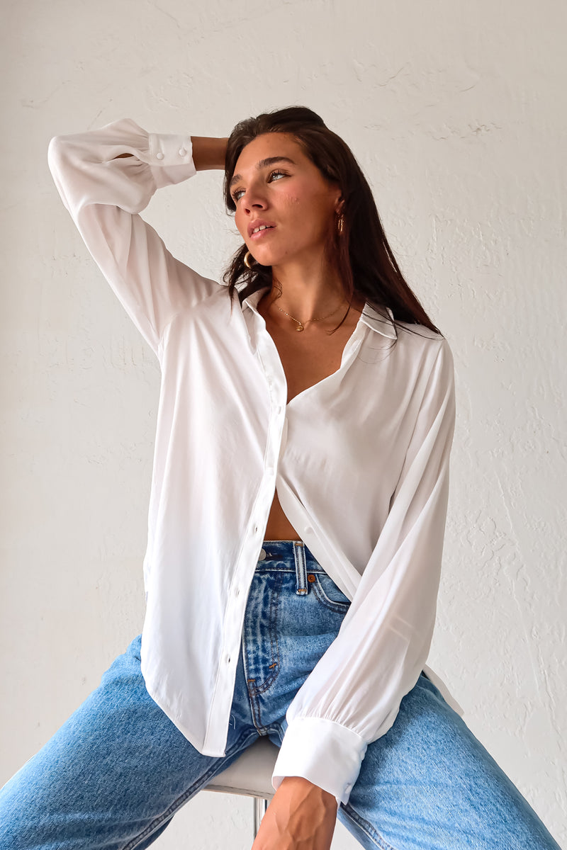 Put a playful twist on your classic work attire with our GABLES LONG SLEEVE BLOUSE. This white, non-lined button down blouse is both lightweight and comfortable for all-day wear. With long sleeves and button wrists, this blouse is perfect for any season. Don't settle for boring office wear, stand out in style!