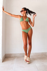 AZUSA/BEVERLY BIKINI - PALMEIRA! This green bikini set features a unique texture detail and a playful sliding triangle top with removable padding and gold accents. The Brazilian cut brief bottom has back ruching for an amazing butt. Made in Colombia by ALILA SWIM