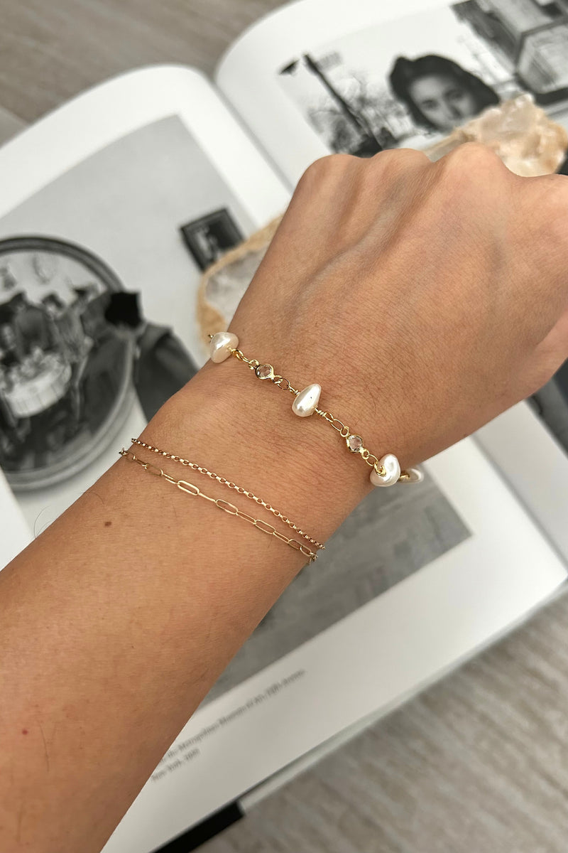 Add a touch of elegance with our Hampton Pearl Bracelet. This gold plated over sterling silver bracelet features pearl bead detailing and is tarnish resistant and hypoallergenic. Stay stylish and comfortable all day long!