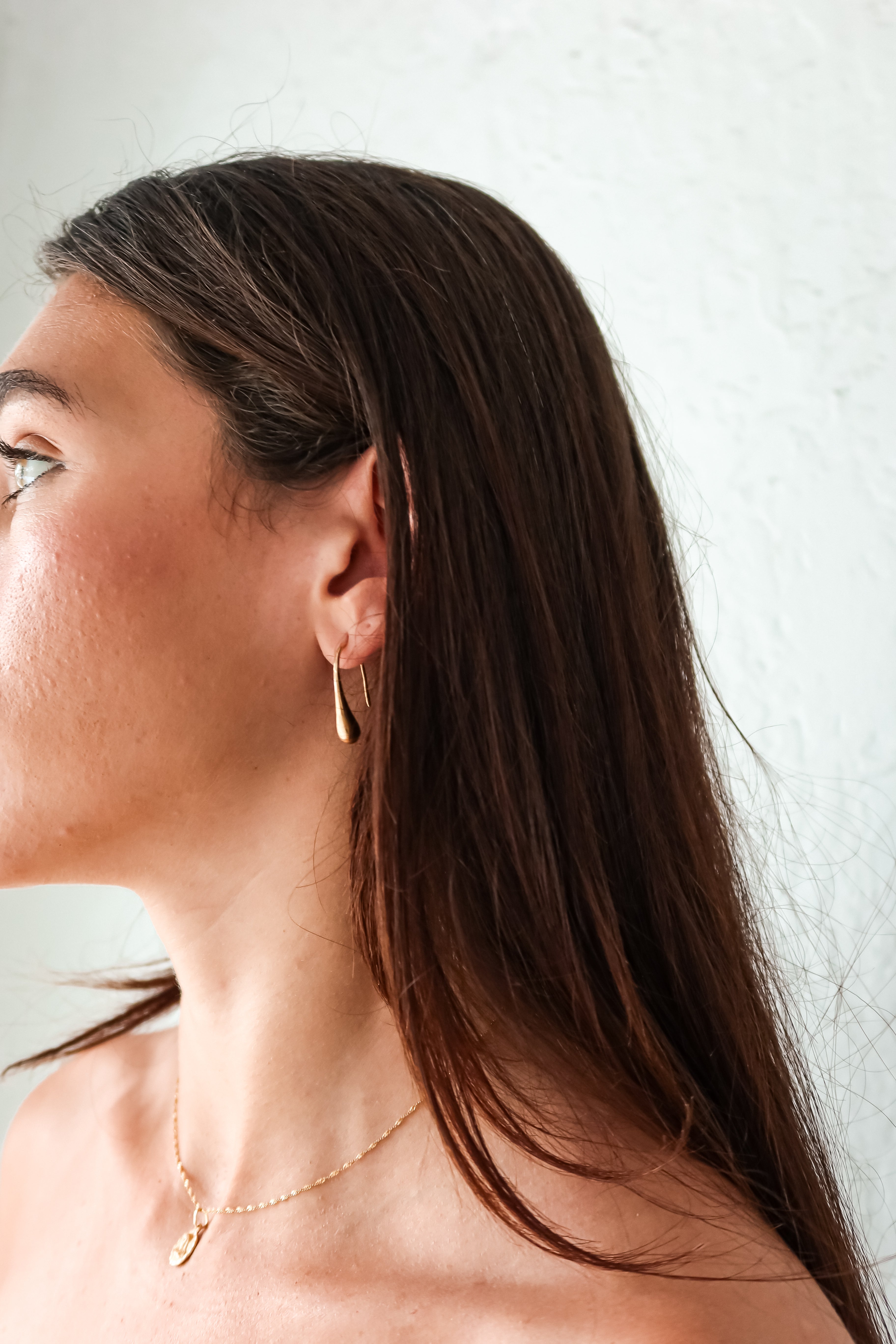 Add a touch of whimsy to your ensemble with these ST Teardrop Earrings. Made of gold plated over sterling silver, these 1 inch length earrings feature a teardrop design that is both elegant and playful. Plus, they are tarnish resistant and hypoallergenic for worry-free wear.