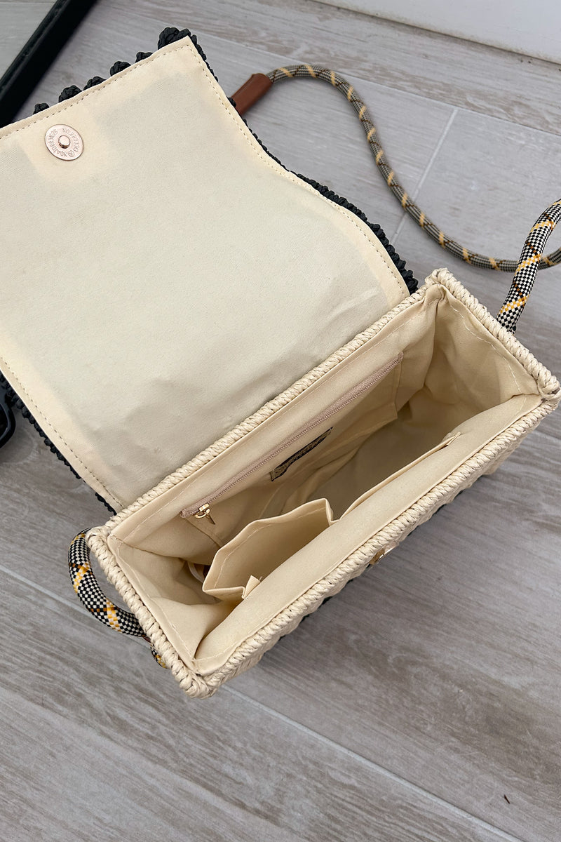 Add a touch of beachy glam with our Positano Bag. The beige and black squared handbag features a gold starfish detail and a unique rope design shoulder strap. Perfectly paired with our Melrose Linen Maxi dress. Snap buckle closure adds convenience and style.