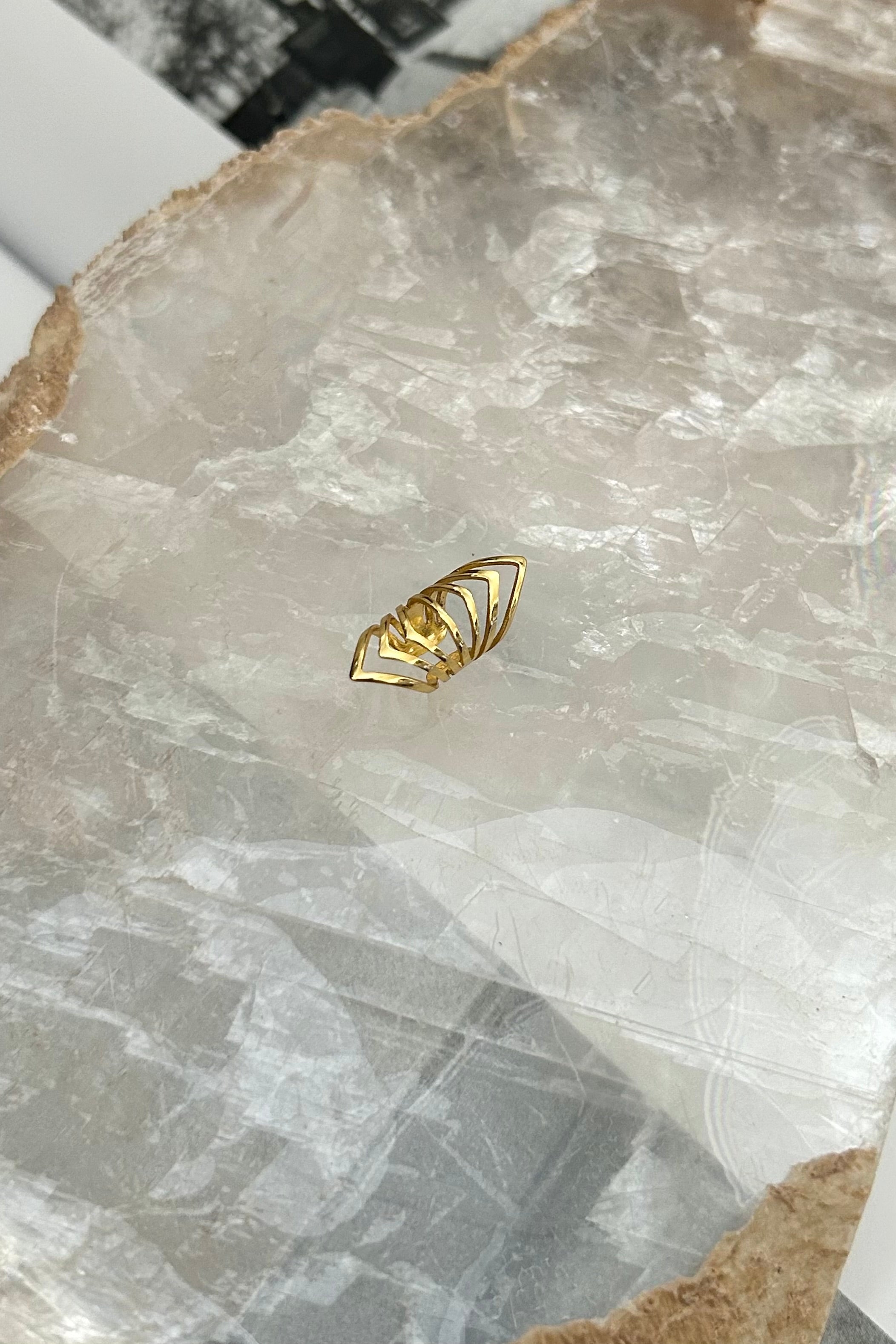 Add a little flare to your jewelry collection with our VIBRATIONS EAR CUFF. Made of gold plated over sterling silver, this ear cuff is not only stylish, but also tarnish resistant and hypoallergenic.