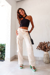 Make a statement on your first date in our FIRST DATE SATIN PANT. The cream color and wide leg style exude elegance, while the side cargo pockets add functionality. With a zipper clip closure and elastic stretch waistband, you'll be comfortable all night long.