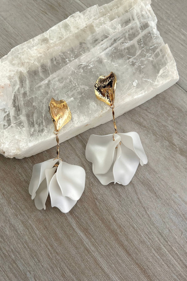 Add some whimsy to your jewelry collection with our ORCHID EARRING. These Gold and White acrylic floral earrings are not only tarnish resistant and hypoallergenic, but also perfect for everyday wear. Embrace your inner flower child with these unique and playful earrings.