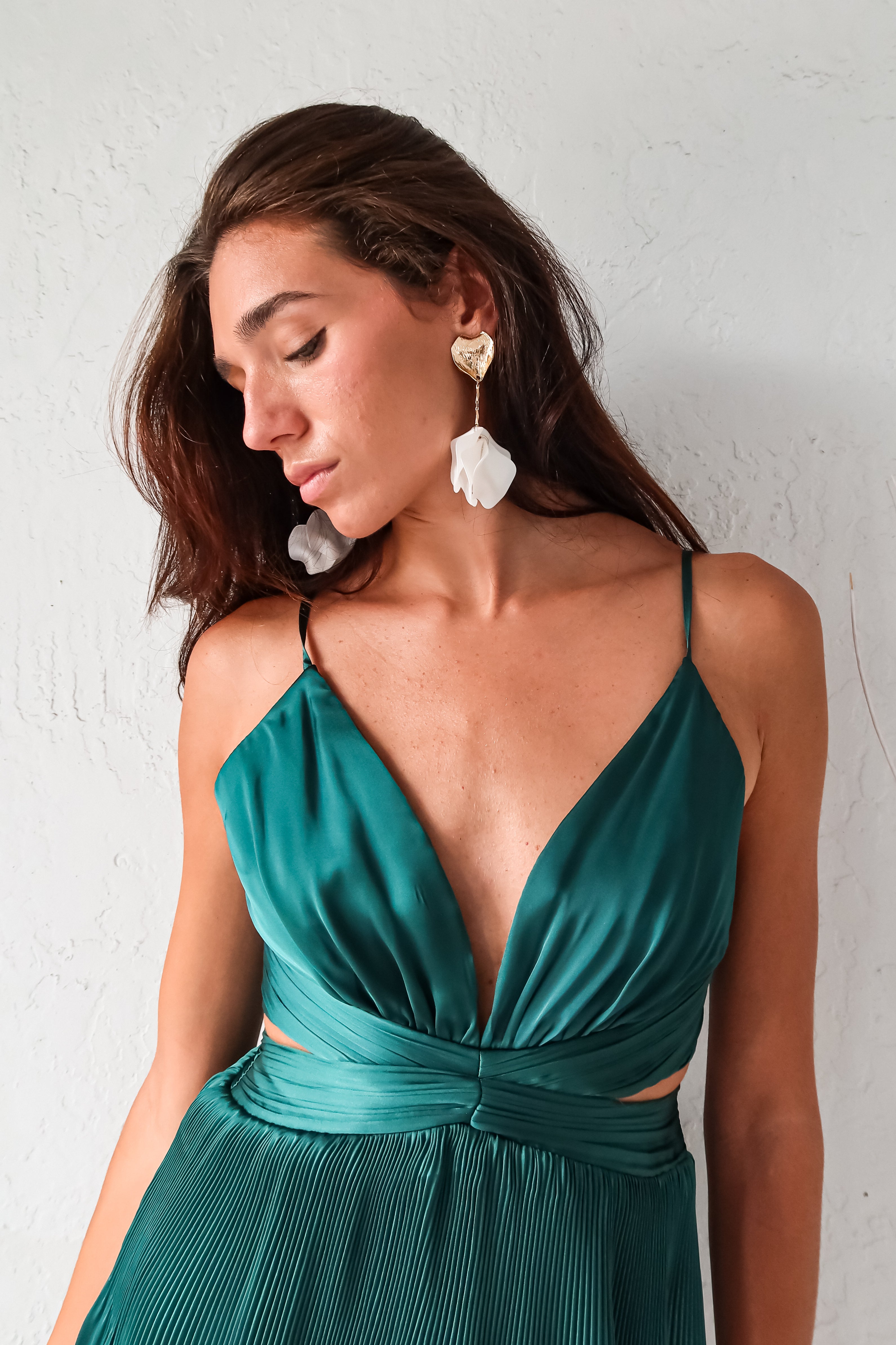 Turn heads in the PARISIAN GARDEN SATIN MAXI DRESS. With an emerald green satin fabric, adjustable shoulder straps, and a back zipper closure, this dress is both comfortable and stunning. The chiffon overlap detail adds a touch of elegance to this playful and chic piece.