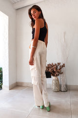 Make a statement on your first date in our FIRST DATE SATIN PANT. The cream color and wide leg style exude elegance, while the side cargo pockets add functionality. With a zipper clip closure and elastic stretch waistband, you'll be comfortable all night long.