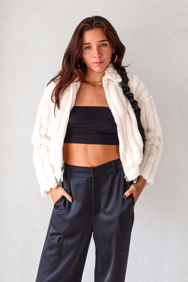 Get cozy and chic with our TIMES SQUARE FAUX FUR JACKET! Made from white faux fur, this cruelty-free jacket features a collared neckline and front zipper closure for a touch of edge. The lining and bottom stretch provide ultimate comfort while ensuring a perfect fit.