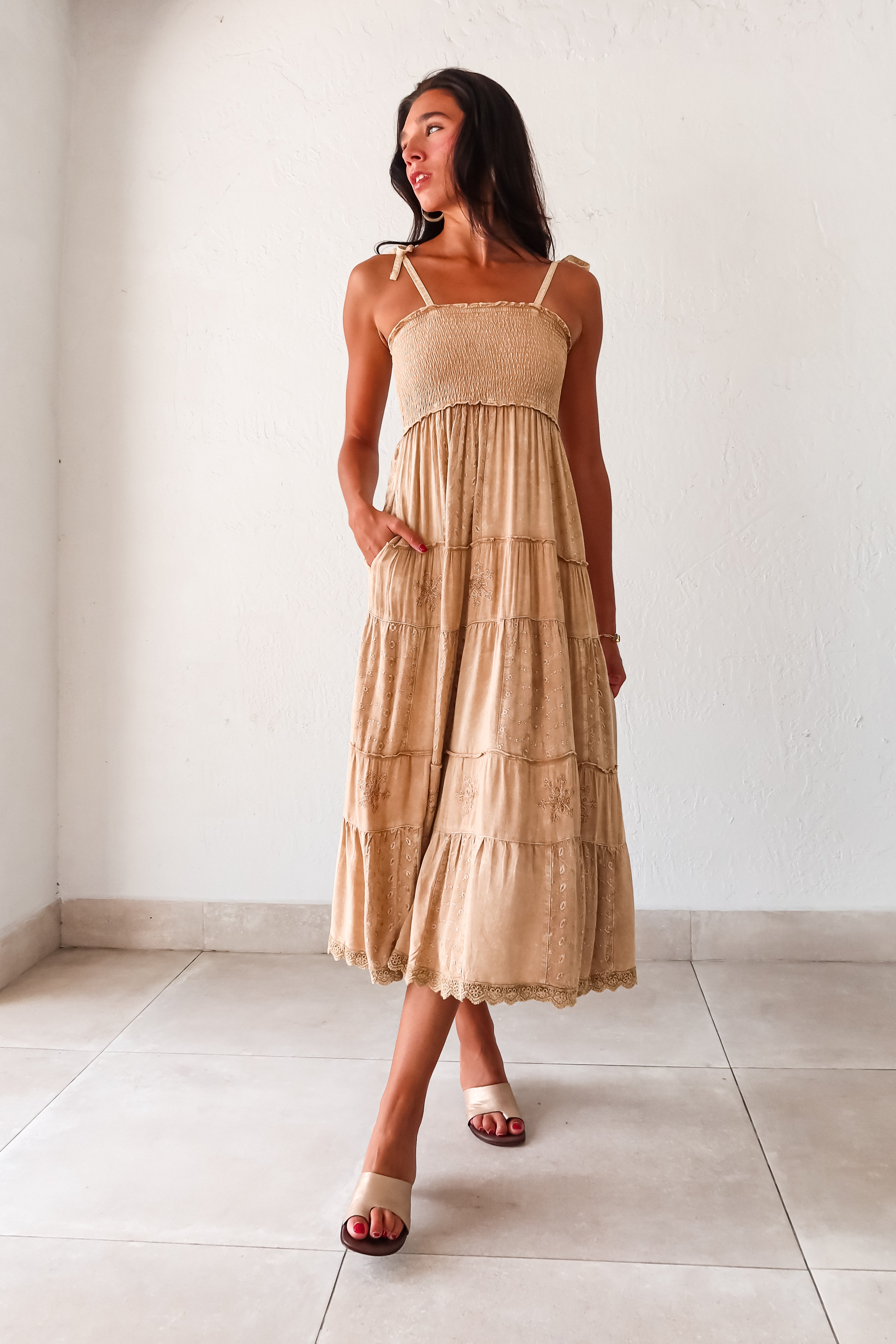  Crosby Eyelet Maxi Dress. This khaki-marigold dress features a smocked bust for the perfect fit, adjustable tie string shoulder straps, and eyelet patchwork detailing. With side pockets and a crochet trim hem, this non-stretch dress is perfect for everyday wear. 