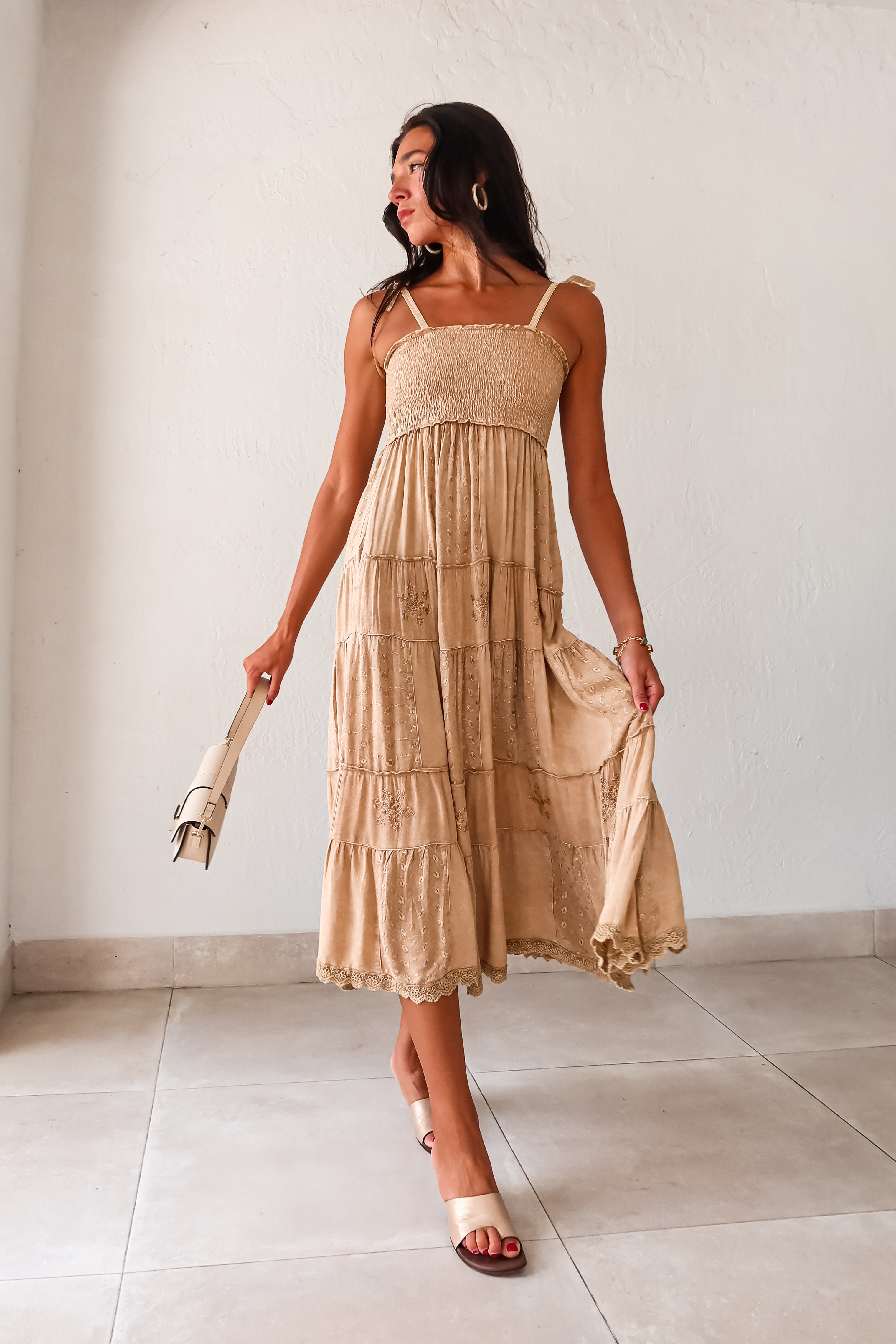  Crosby Eyelet Maxi Dress. This khaki-marigold dress features a smocked bust for the perfect fit, adjustable tie string shoulder straps, and eyelet patchwork detailing. With side pockets and a crochet trim hem, this non-stretch dress is perfect for everyday wear. 