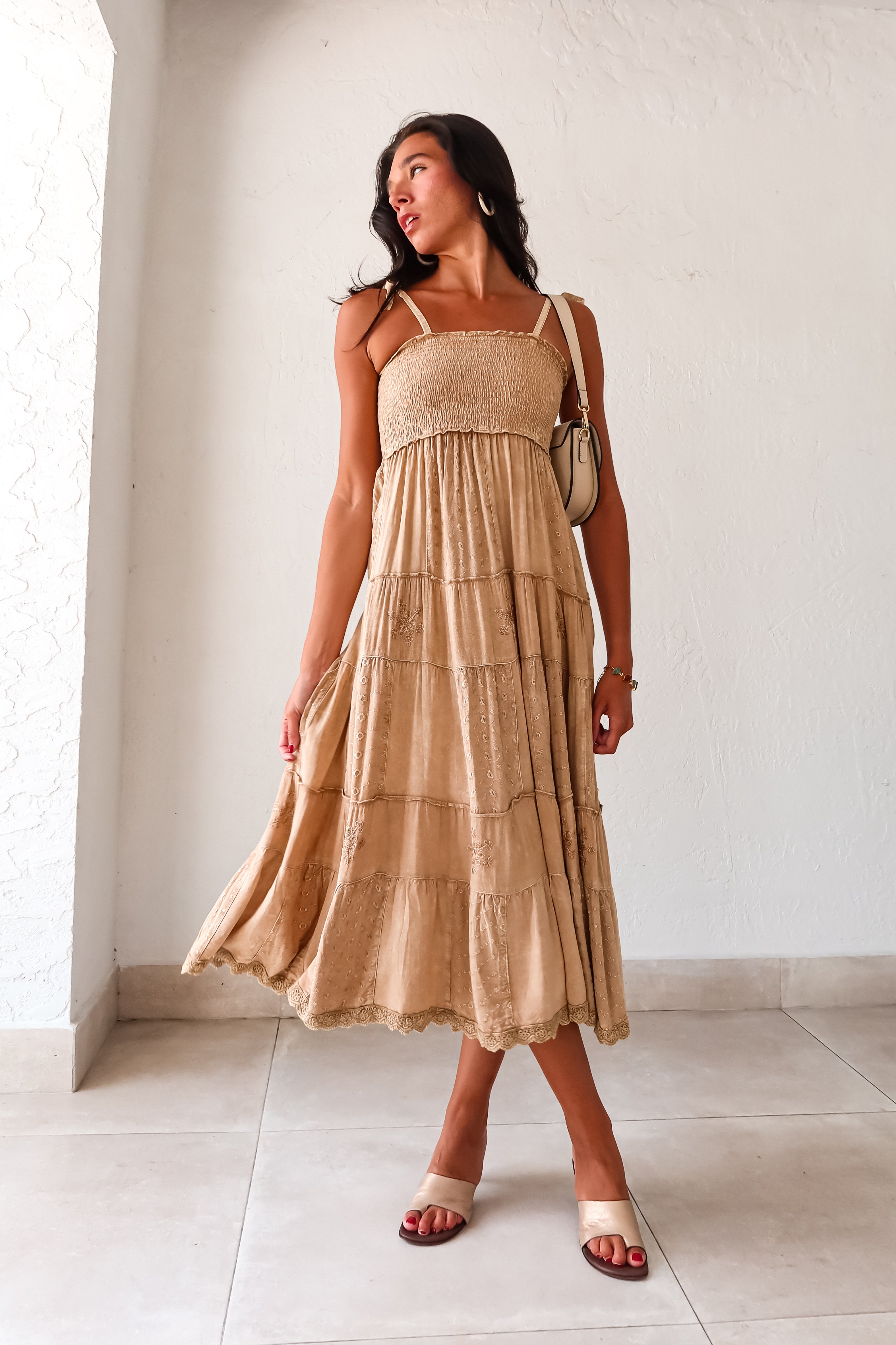  Crosby Eyelet Maxi Dress. This khaki-marigold dress features a smocked bust for the perfect fit, adjustable tie string shoulder straps, and eyelet patchwork detailing. With side pockets and a crochet trim hem, this non-stretch dress is perfect for everyday wear. 