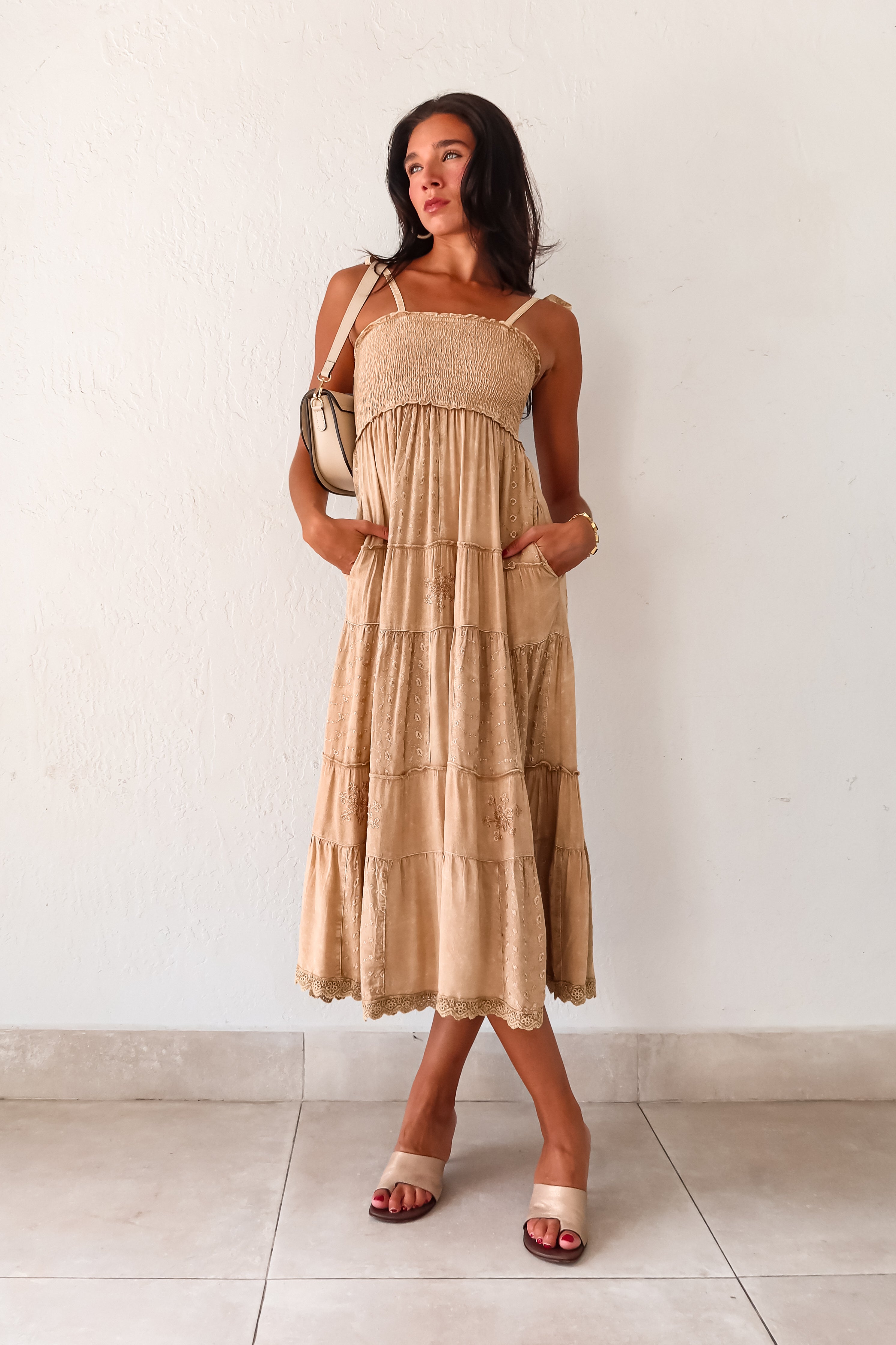  Crosby Eyelet Maxi Dress. This khaki-marigold dress features a smocked bust for the perfect fit, adjustable tie string shoulder straps, and eyelet patchwork detailing. With side pockets and a crochet trim hem, this non-stretch dress is perfect for everyday wear. 