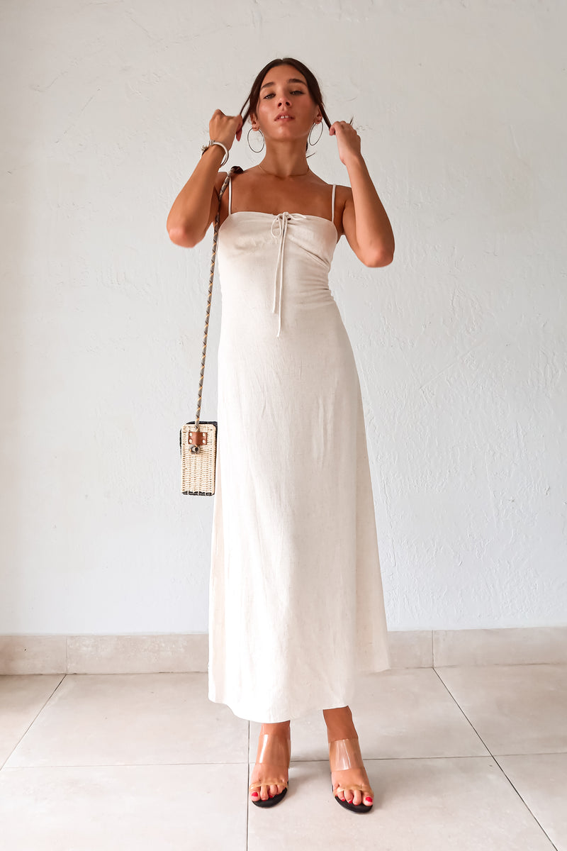 Introducing our MELROSE LINEN MAXI DRESS! This beautiful oatmeal colored dress features adjustable shoulder straps for a perfect fit and a front tie detail for added style. The elastic back straps ensure comfortable wear while the back zipper closure provides easy on and off. Perfect for any occasion!