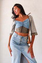 Queen Denim Crop Top! This mix denim crop top features a smock back for a comfortable fit and 3/4 sleeves with a unique crochet design. With elastic at the shoulders, you can easily switch up your look for an on or off shoulder style. The slight stretch and true to size fit make it a perfect staple for any occasion. And best of all, it pairs perfectly with our Melrose Denim Midi Skirt.