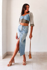 Queen Denim Crop Top! This mix denim crop top features a smock back for a comfortable fit and 3/4 sleeves with a unique crochet design. With elastic at the shoulders, you can easily switch up your look for an on or off shoulder style. The slight stretch and true to size fit make it a perfect staple for any occasion. And best of all, it pairs perfectly with our Melrose Denim Midi Skirt.