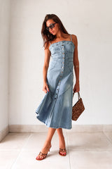 Get ready to rock a laid-back look with our Cypress Denim Midi Dress. This versatile piece features a front button down closure and adjustable shoulder straps for a customizable fit. The stretchy fabric and smocked backing provide ultimate comfort, while the chest stitch detail adds a touch of unique style. Non lined for a lightweight feel.