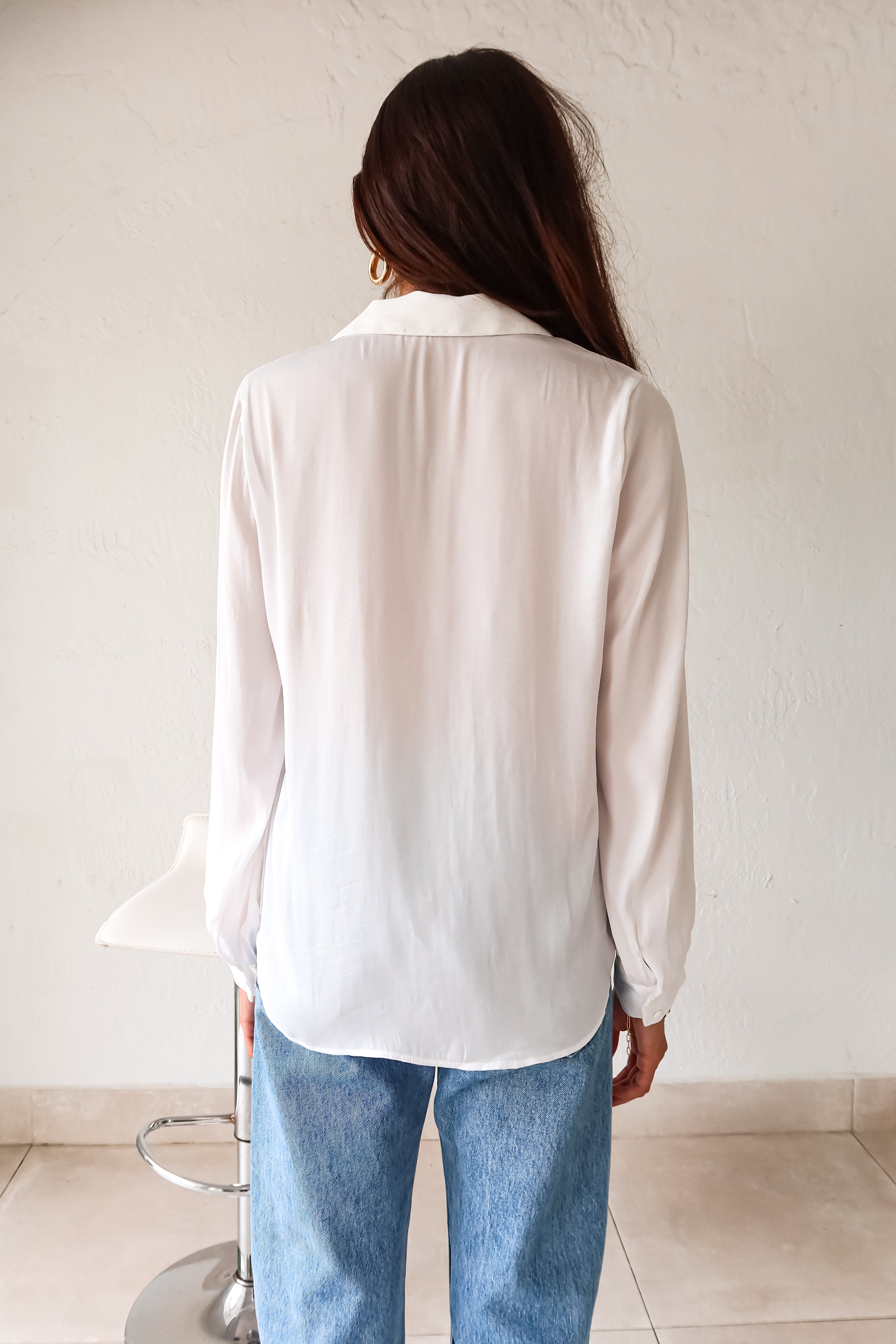 Put a playful twist on your classic work attire with our GABLES LONG SLEEVE BLOUSE. This white, non-lined button down blouse is both lightweight and comfortable for all-day wear. With long sleeves and button wrists, this blouse is perfect for any season. Don't settle for boring office wear, stand out in style!