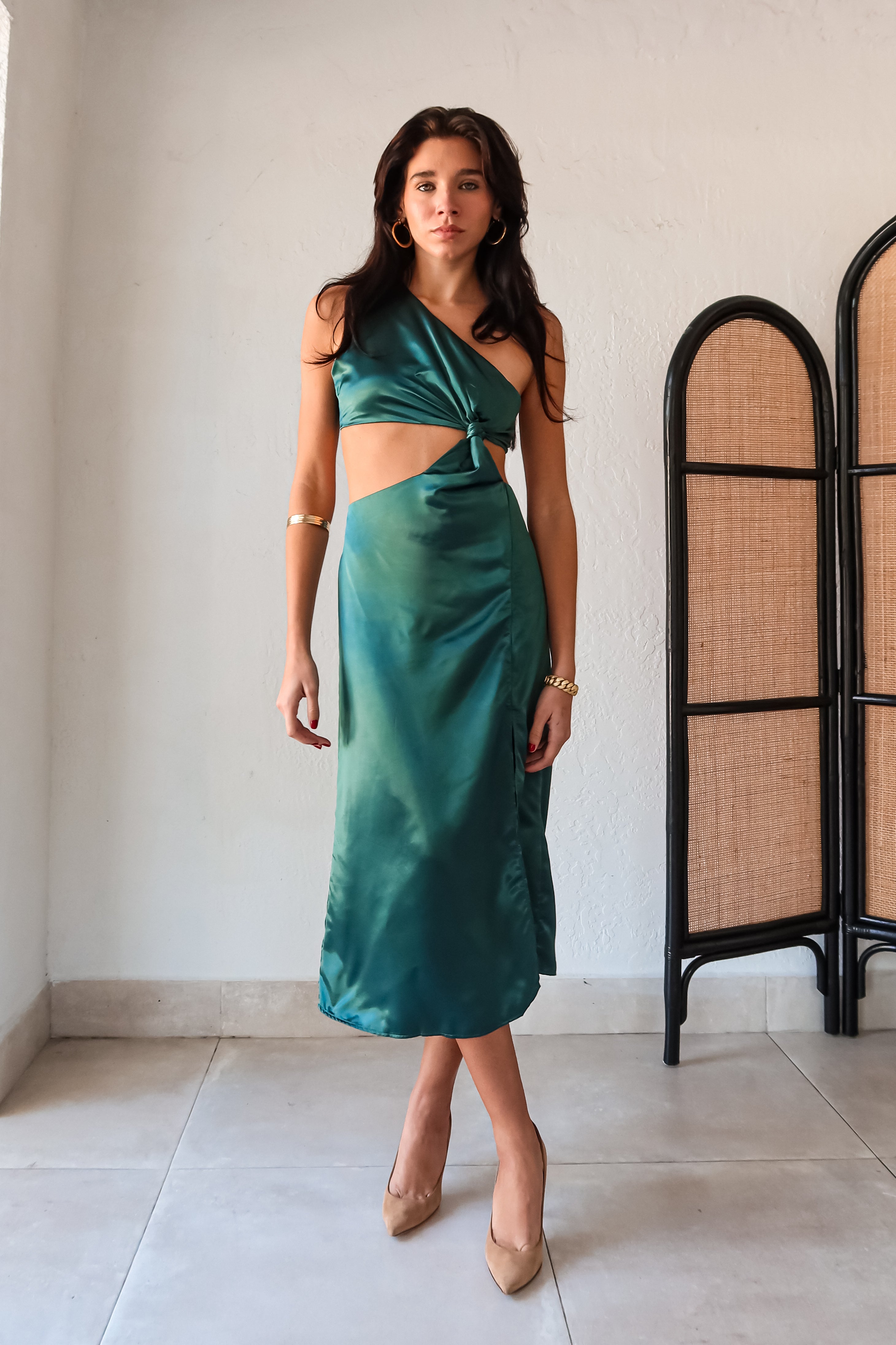 Get ready to slay at cocktail hour with this jewel green satin maxi dress! The one shoulder top with a knot detail adds a touch of glamour, while the left leg slit shows off your killer legs. Ties around back keep the look secure, and a bottom zipper closure makes getting dressed a breeze.