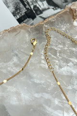 Add a touch of sparkle to your outfit with this gold plated choker chain, featuring a charming circle detail. With its tarnish-resistant and hypoallergenic features, you can shine all day without worrying about skin irritation. A must-have for a fun, playful look!