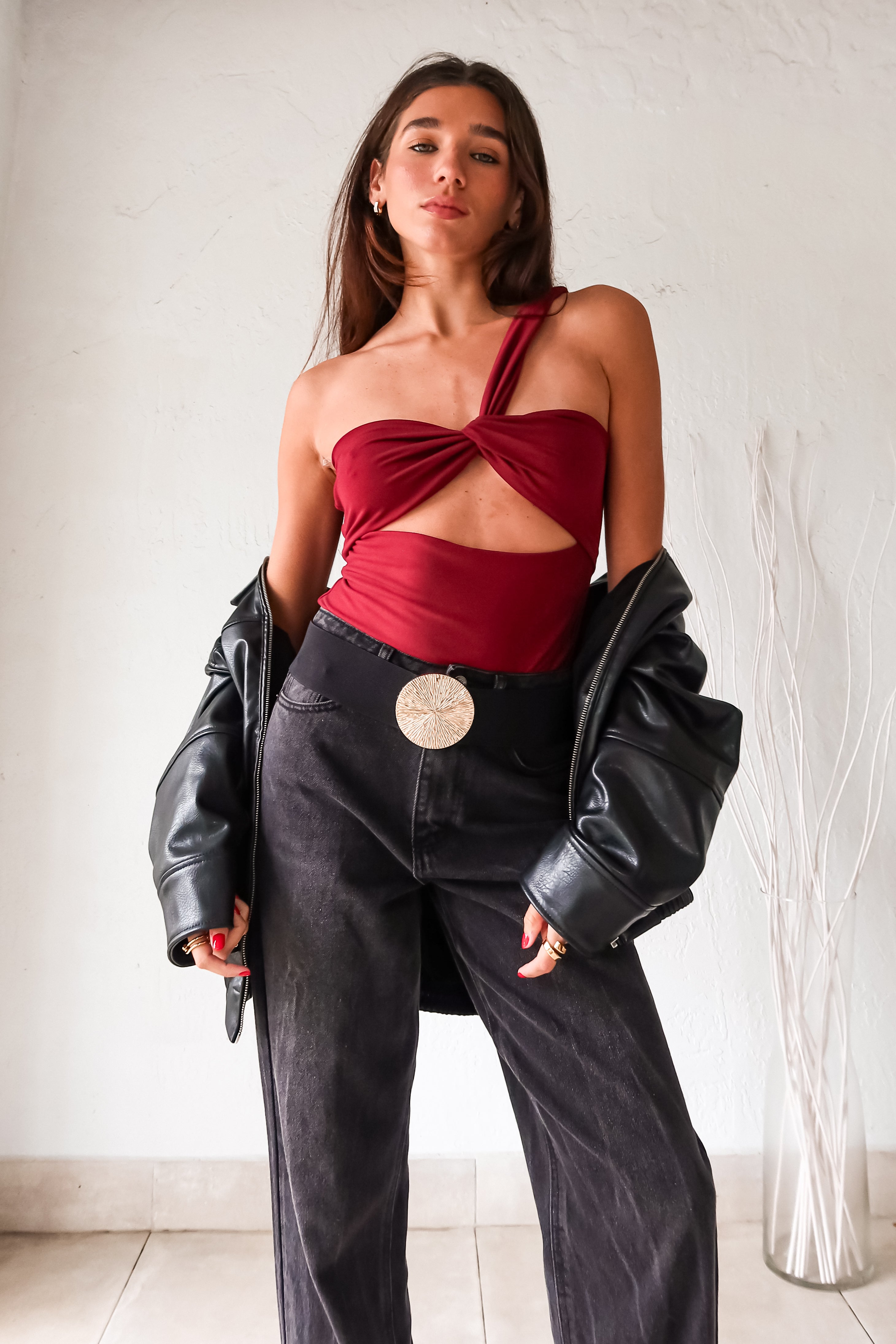 Have a change of plans? This wine red bodysuit has you covered with its versatile asymmetrical top, allowing you to wear it in the front or back. Its stretchy and lined design ensures a comfortable fit. Perfect for any last-minute adjustments or spontaneous outings.