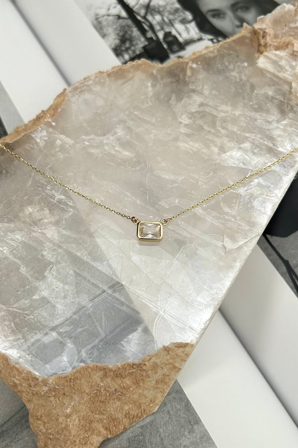 Shine bright with this CZ Rectangle Necklace! Made of gold plated sterling silver, the necklace boasts a rectangle charm adorned with a stunning gem. Say goodbye to tarnishing and allergies with the added benefits of tarnish resistance and hypoallergenic materials.