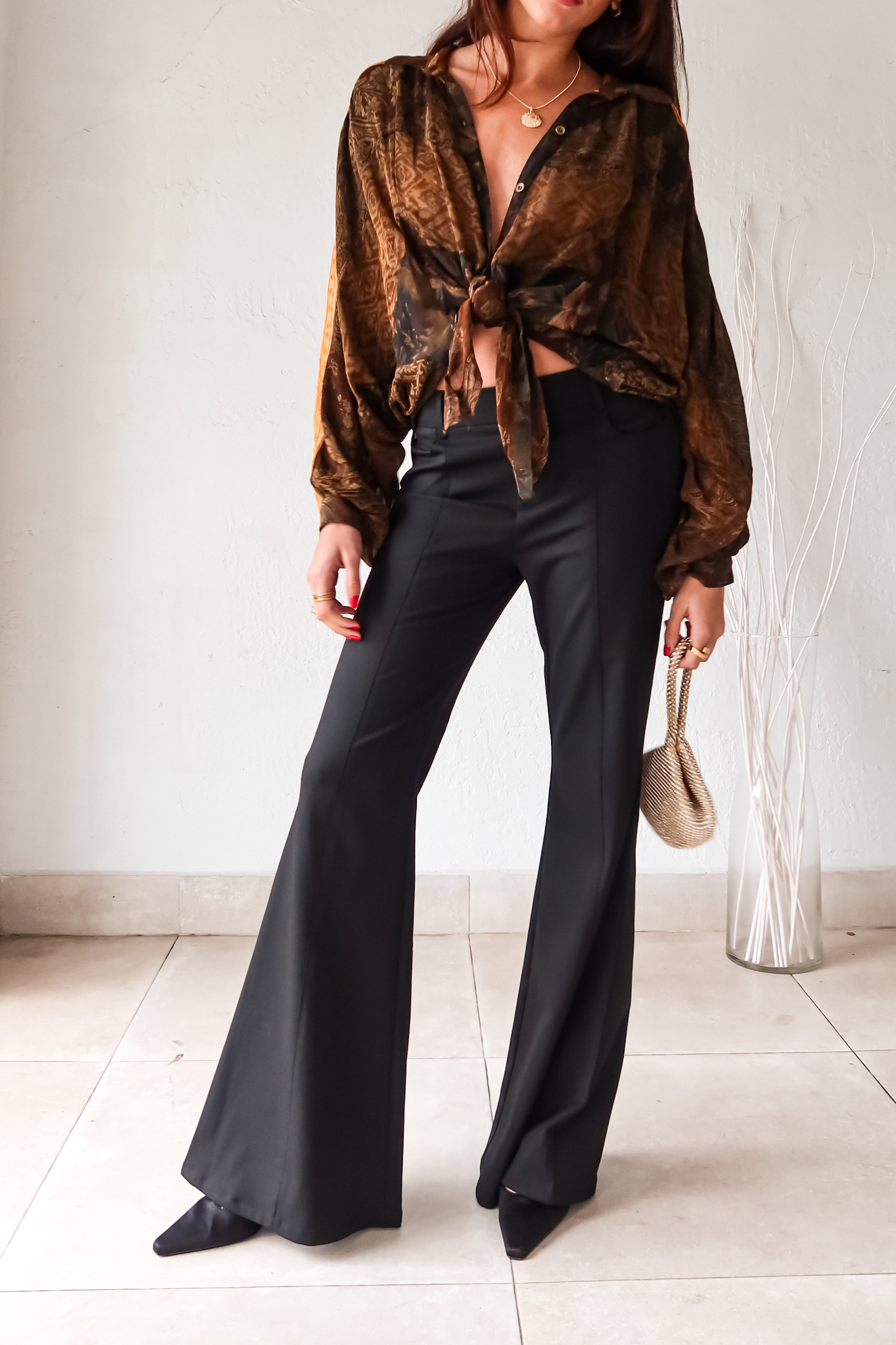 Don't work it, WORK IT in these black trousers! With a pleated front, belt loops, clip zipper closure, and front pockets, these trousers mean business. Say goodbye to boring work pants and hello to sleek and stylish office attire. 