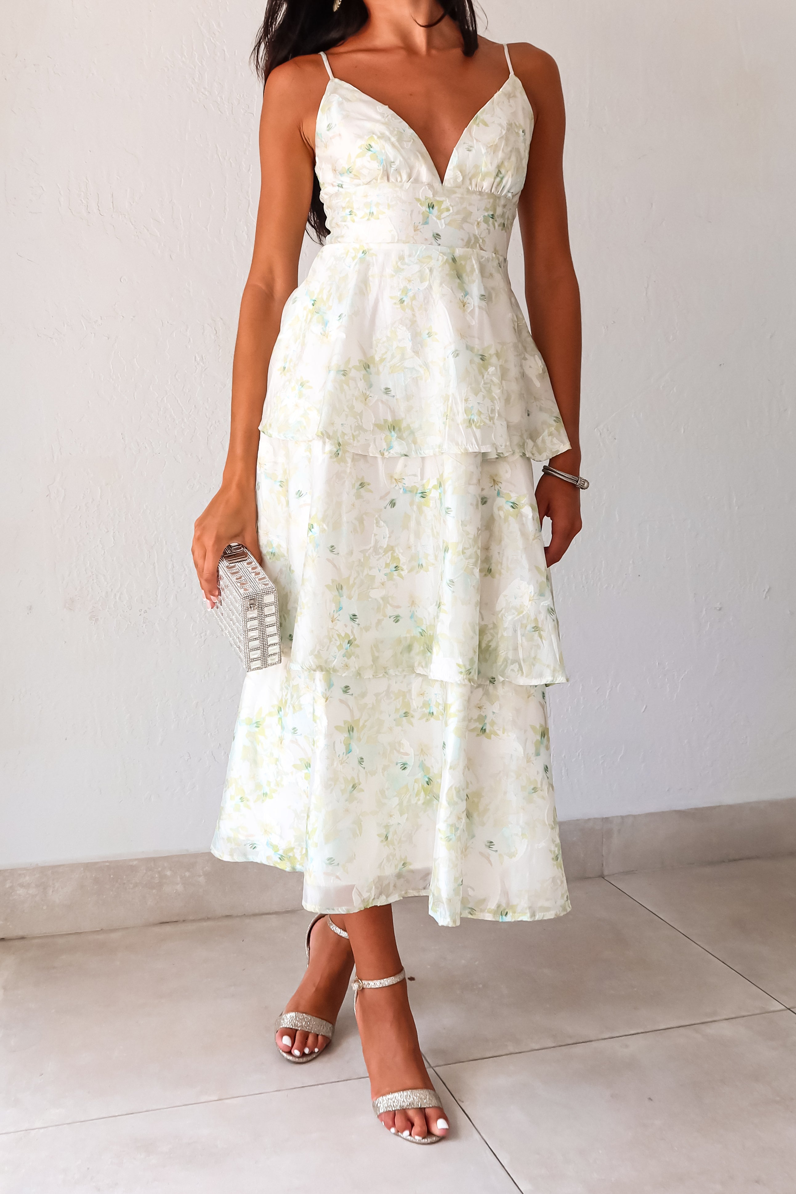 Get ready to bloom in the GARDEN PARTY CHIFFON MIDI DRESS. This romantic dress features a delicate pastel floral print on flowy chiffon, perfect for a party day or night. The tiered design adds a flirty touch while the adjustable shoulder straps and back zipper make for a comfortable fit. Non-stretch and lined for a polished look. 