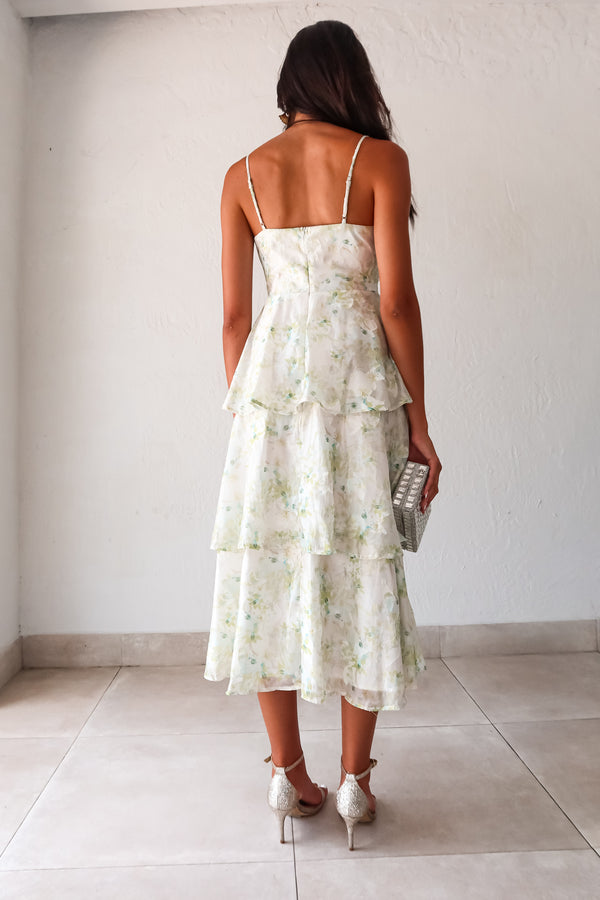 Get ready to bloom in the GARDEN PARTY CHIFFON MIDI DRESS. This romantic dress features a delicate pastel floral print on flowy chiffon, perfect for a party day or night. The tiered design adds a flirty touch while the adjustable shoulder straps and back zipper make for a comfortable fit. Non-stretch and lined for a polished look. 