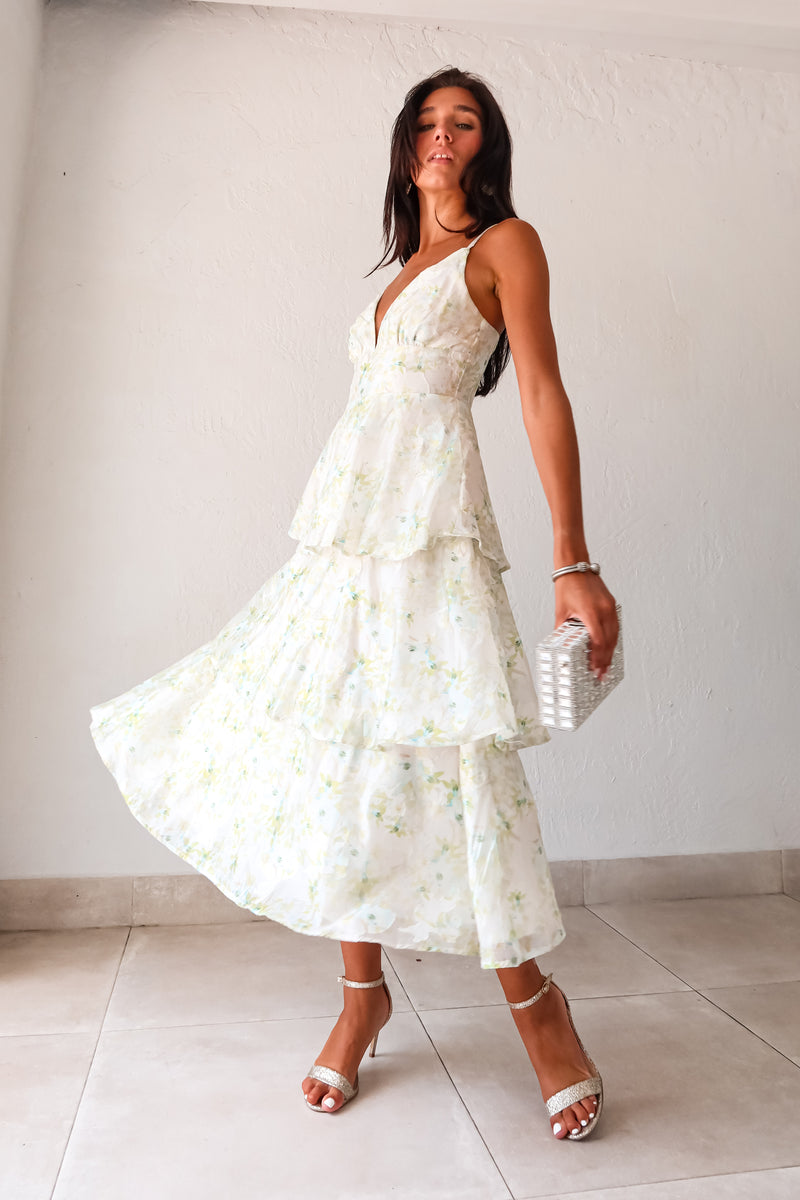 Get ready to bloom in the GARDEN PARTY CHIFFON MIDI DRESS. This romantic dress features a delicate pastel floral print on flowy chiffon, perfect for a party day or night. The tiered design adds a flirty touch while the adjustable shoulder straps and back zipper make for a comfortable fit. Non-stretch and lined for a polished look. 