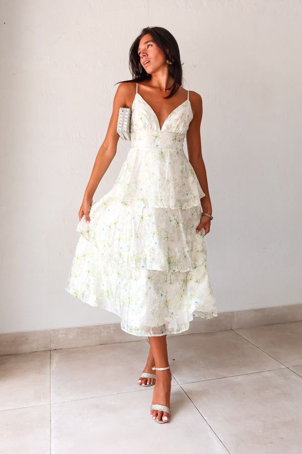 Get ready to bloom in the GARDEN PARTY CHIFFON MIDI DRESS. This romantic dress features a delicate pastel floral print on flowy chiffon, perfect for a party day or night. The tiered design adds a flirty touch while the adjustable shoulder straps and back zipper make for a comfortable fit. Non-stretch and lined for a polished look. 