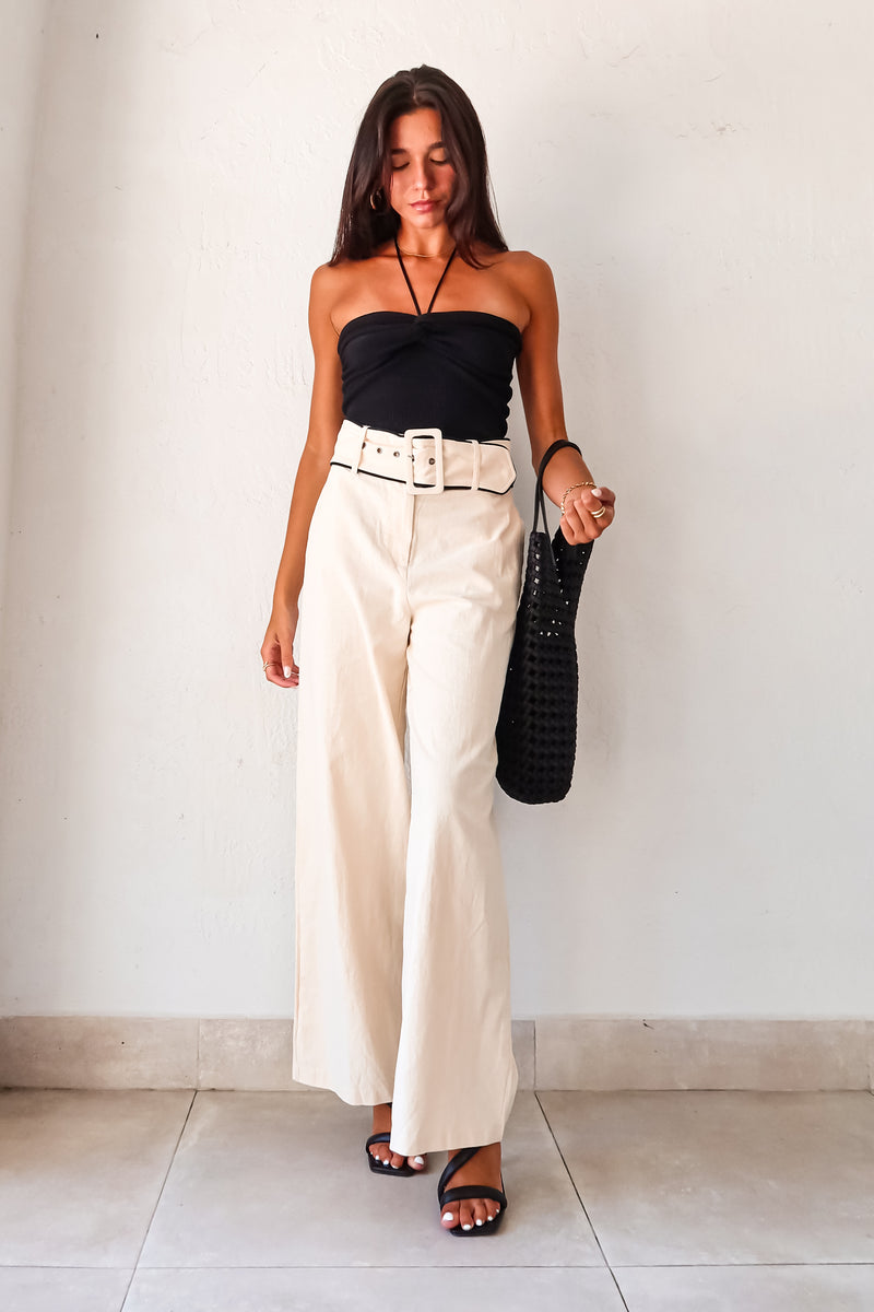 Unleash your inner fashionista with our Napoli Belted Linen Pant! In a chic cream color with contrasting black trim at the waistline, these pants will elevate any outfit. Complete with front pockets, zipper button closure, and an optional belt, these non-stretch, non-lined pants run true to size. Hand wash cold and pair them with the Eclipse Knit Top and Silvana Woven Tote for a stylish, effortless look.