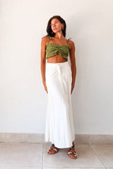 Unleash your inner boho-chic with the MISOMMAR LINEN MAXI SKIRT. Made of breathable white linen, this pleated maxi skirt features convenient front pockets and a secure zipper button closure. The non-stretch fabric adds structure, while the lining ensures comfort. Pair with the Arcadia Smart Crop Top for a trendy and effortlessly stylish look.