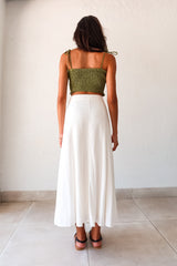 Unleash your inner boho-chic with the MISOMMAR LINEN MAXI SKIRT. Made of breathable white linen, this pleated maxi skirt features convenient front pockets and a secure zipper button closure. The non-stretch fabric adds structure, while the lining ensures comfort. Pair with the Arcadia Smart Crop Top for a trendy and effortlessly stylish look.