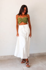 Unleash your inner boho-chic with the MISOMMAR LINEN MAXI SKIRT. Made of breathable white linen, this pleated maxi skirt features convenient front pockets and a secure zipper button closure. The non-stretch fabric adds structure, while the lining ensures comfort. Pair with the Arcadia Smart Crop Top for a trendy and effortlessly stylish look.