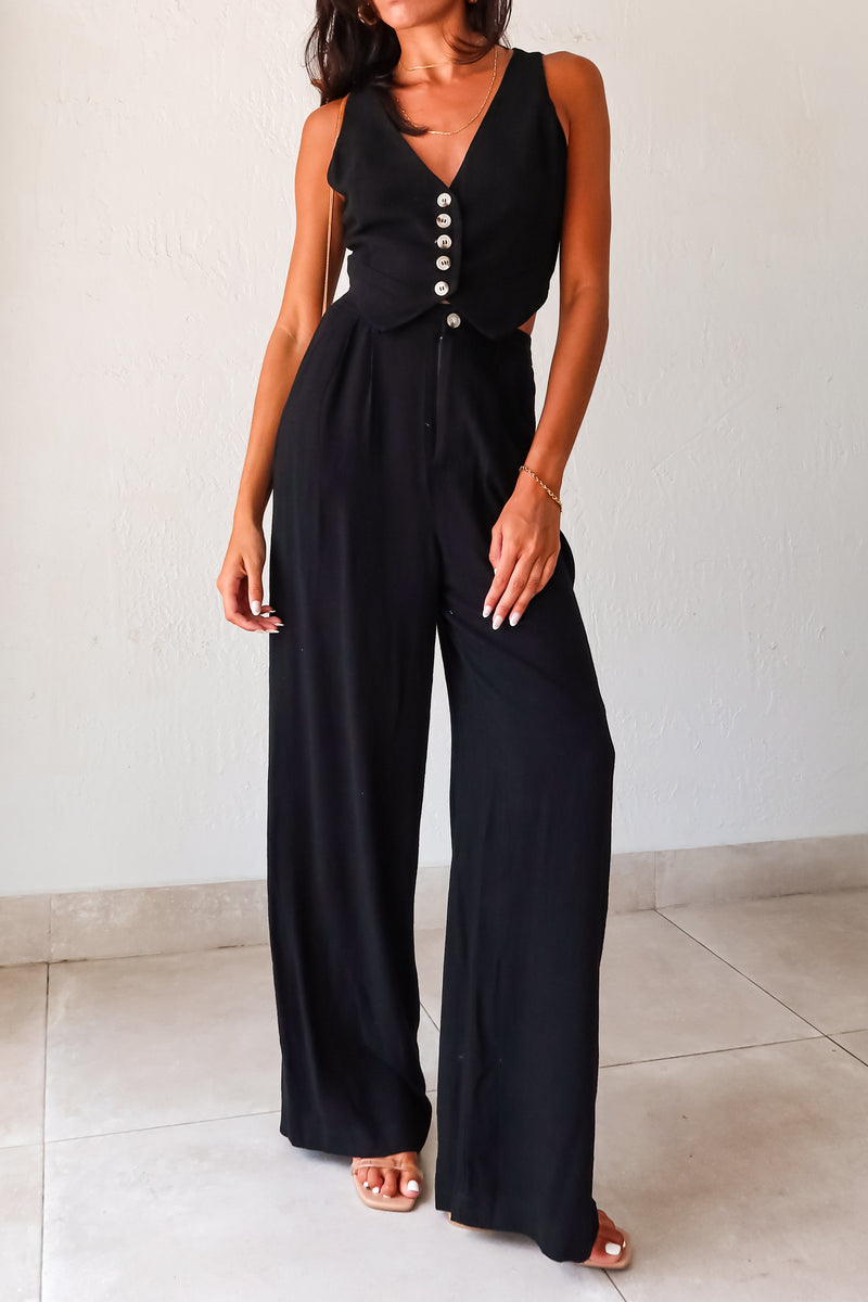 Slip into comfort and style with the ON THE WAY LINEN PANT SET in black. This versatile pant set features a vest top with a front button closure and pants with a zipper button closure. With front pockets, a stretchy waist back, and a lined top, it's the perfect mix of fashion and functionality. No need to compromise comfort for style, as this non-stretch set runs true to size.