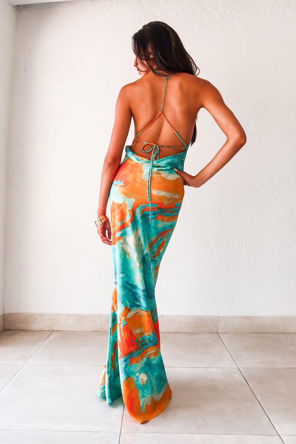 Sunset Views satin maxi dress - now in 2 new colors! This luxe crinkle dress features a cowl neck bust, low draped back, and gold chain detail. Its side pleating and non-stretch fabric make it perfect for any special occasion.