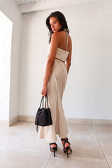  TOP TIER SKIRT SET! This beige light denim maxi skirt set features a halter cropped top that ties around the neck and a high waist maxi skirt with a raw edge design and hem. With a flattering fit and non-stretch, non-lined fabric, this set is perfect for any occasion. Pair it with our Becca Woven Mini bag for a complete look. 