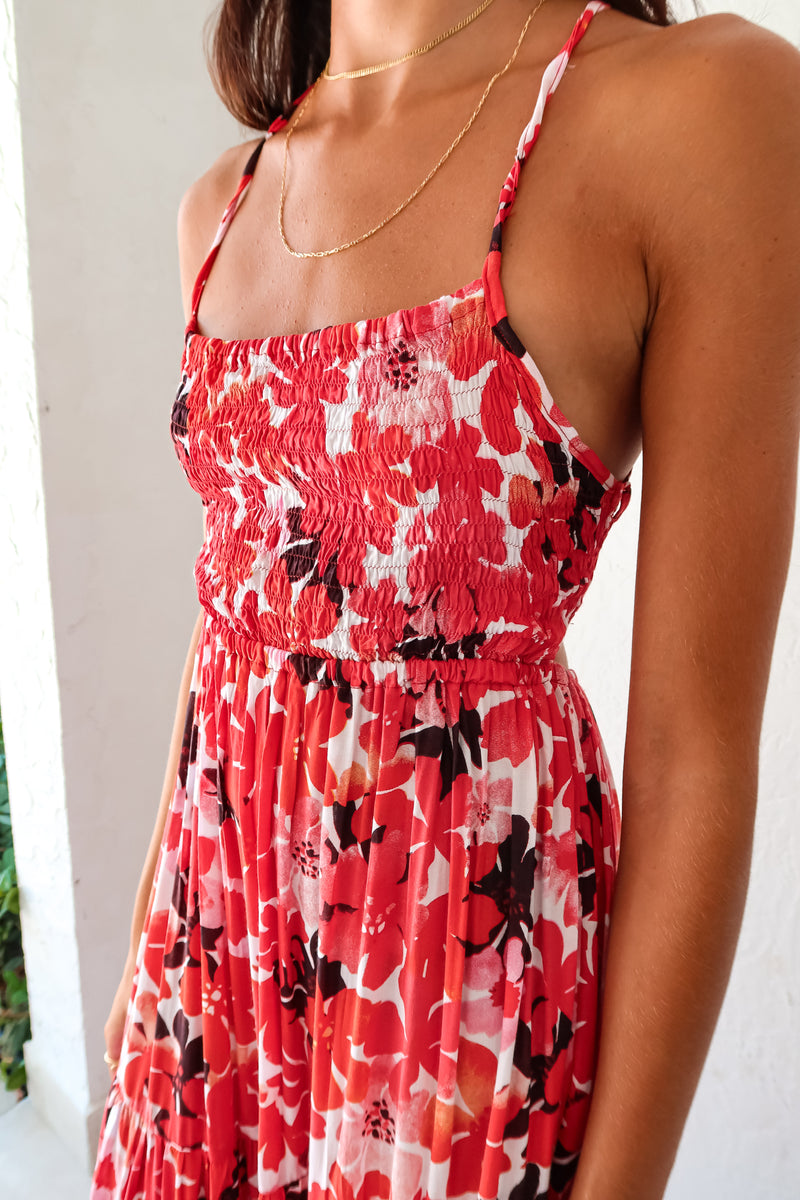 Be the life of the party in our WONDERLAND VISION MAXI DRESS! This floral dress features a playful red, pink, white, and black design, with an adjustable tie string back and smocked bust for a comfortable and flattering fit. With non-lined, non-stretch material and one size fitting XS-L, you'll be sure to turn heads in this quirky, fun dress.