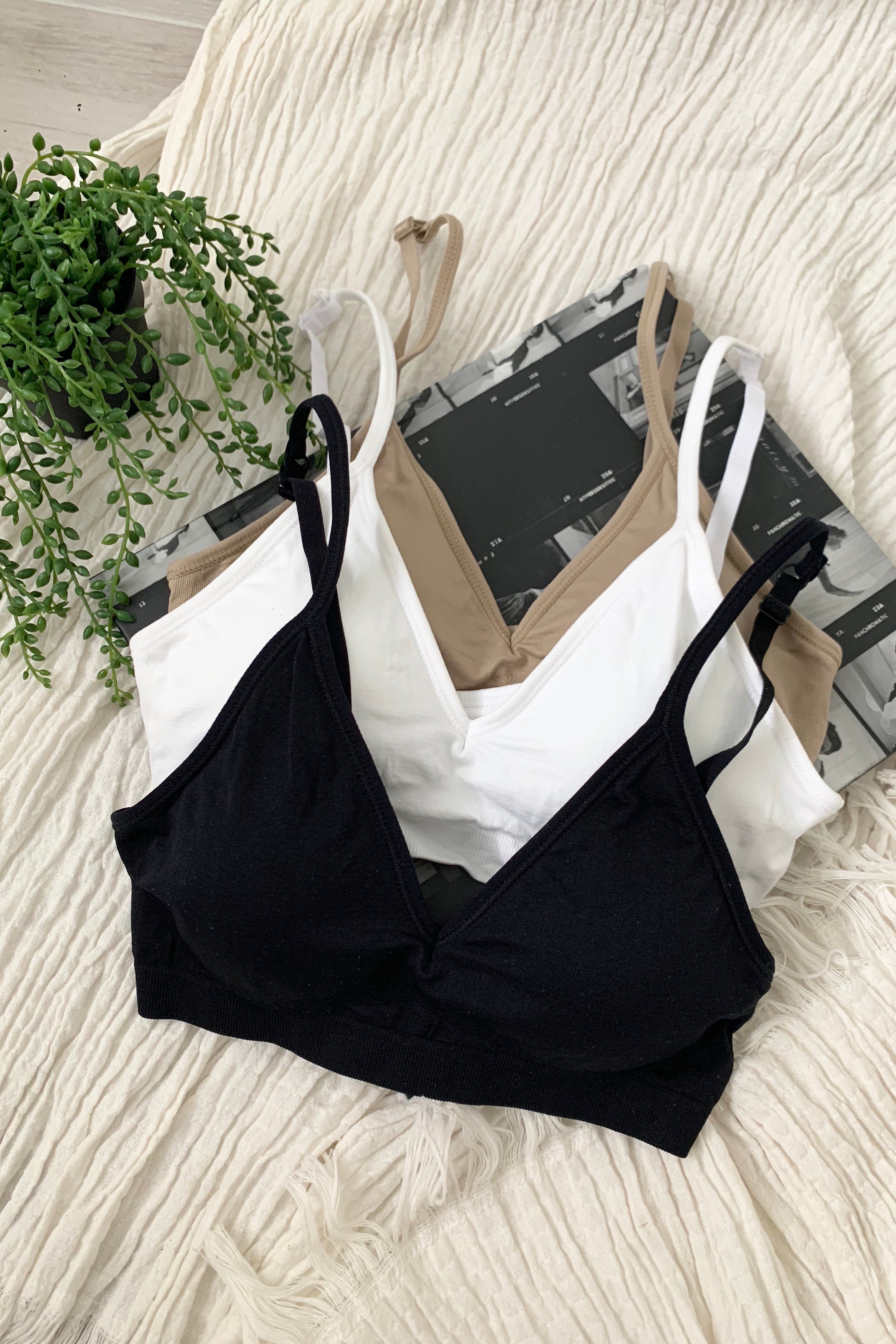 Embrace comfort and style with our CARMELA BRALETTE. Our most popular bralette to date, it features a slip-on design with removable padding and adjustable shoulder straps. Made with soft and stretchy nylon, this one size fits all bralette is perfect for all-day wear. Hand wash cold for best results.